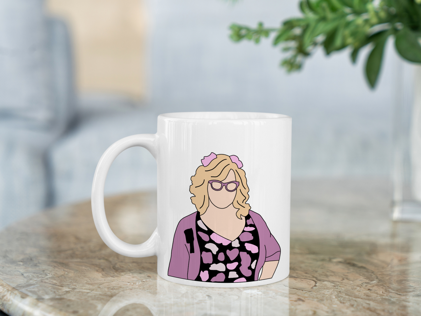 A white ceramic mug with a drawing of Penelope Garcia from Criminal Minds on the front. This is a 10oz mug which is perfect for fans of Criminal Minds, particularly the character Penelope Garcia. Made and sold by Krissi's Creations.