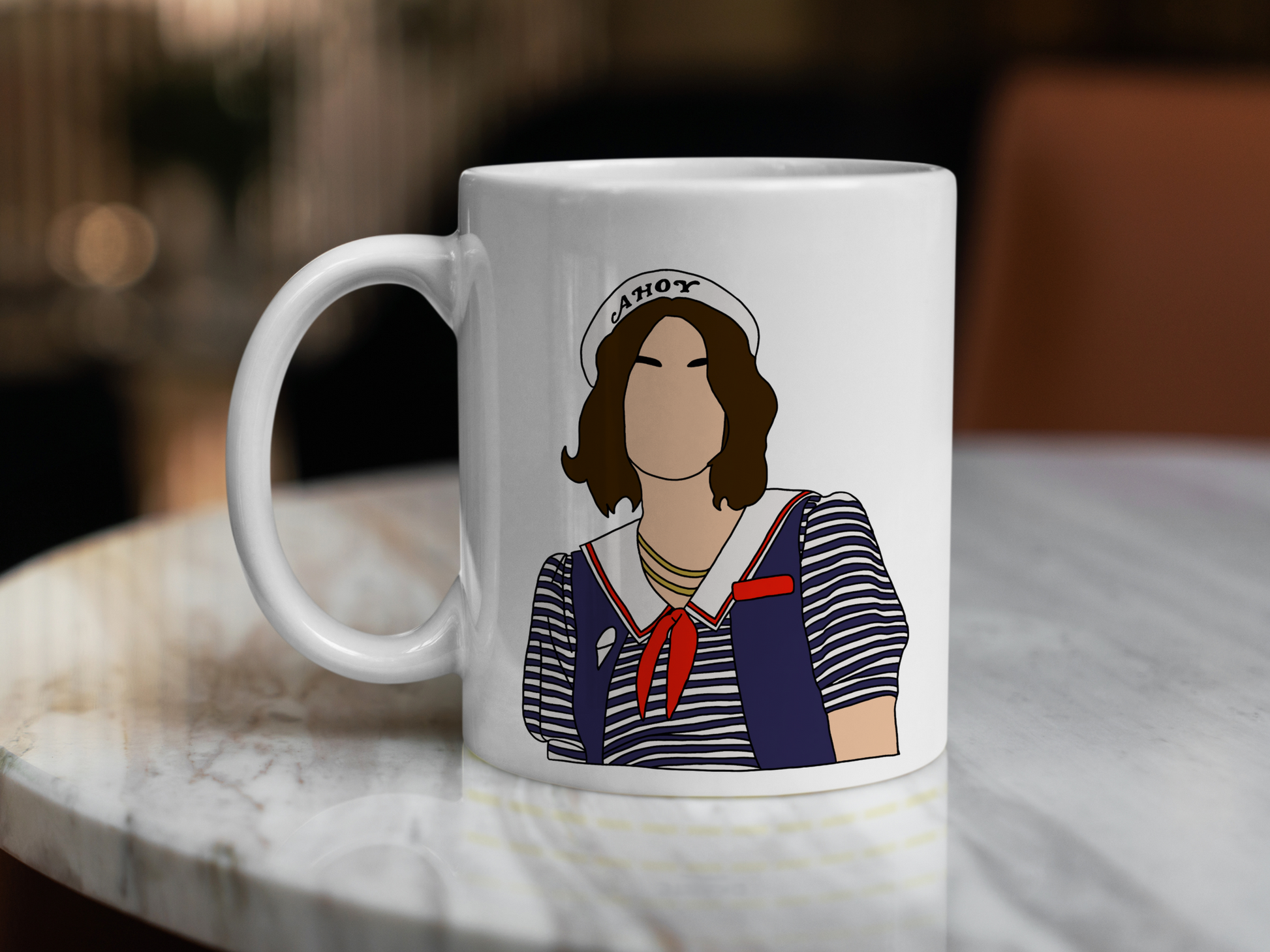 A white ceramic mug with a drawing of Robin Buckley from Stranger Things on the front. This is a 10oz mug which is perfect for fans of Stranger Things, particularly the character Robin Buckley. Made and sold by Krissi's Creations.