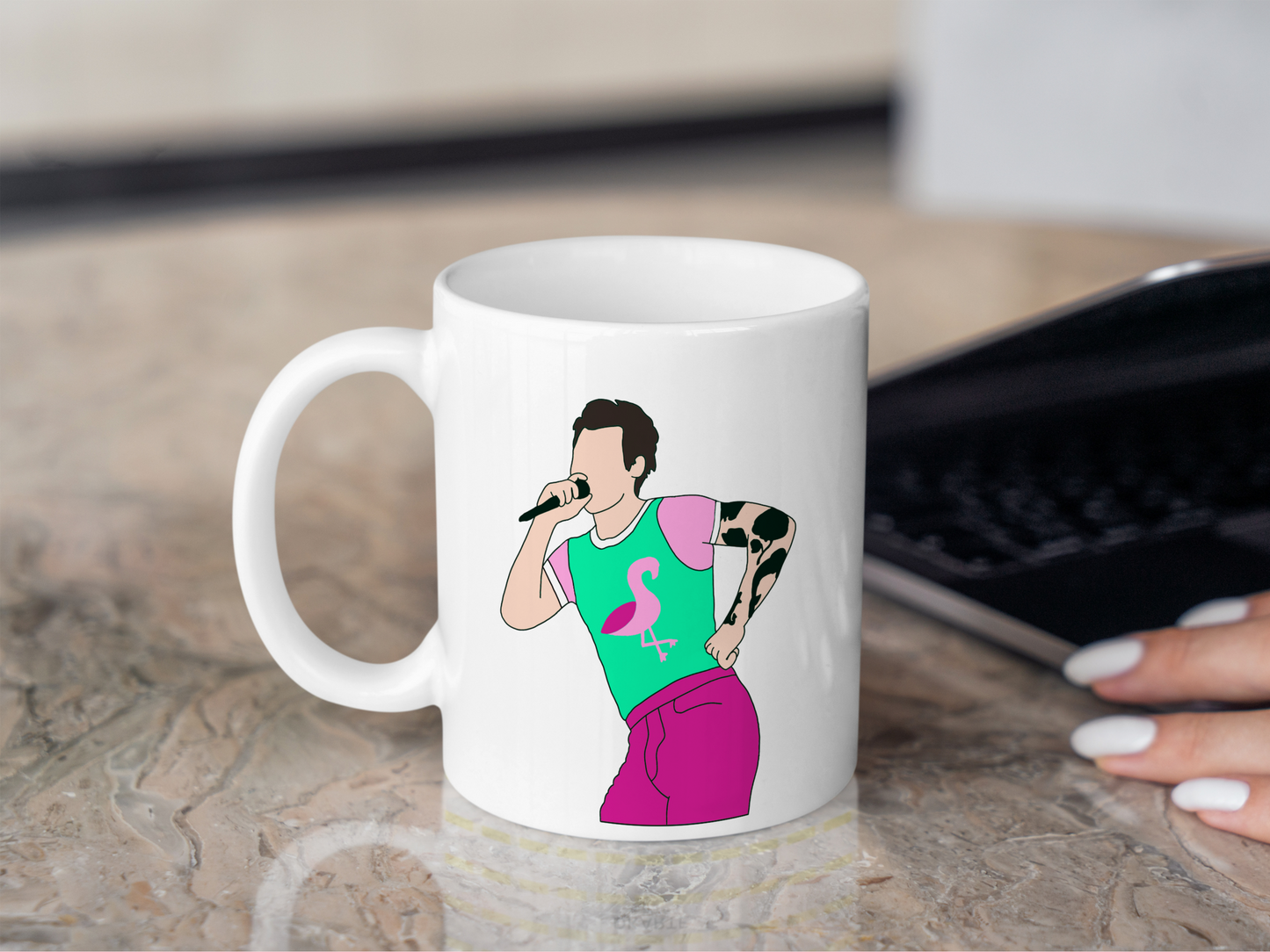 A white ceramic mug with a drawing of Harry Styles Cardiff Night 2 Outfit on the front. This is a 10oz mug which is perfect for fans of Harry Styles Love on Tour Concert. Made and sold by Krissi's Creations.