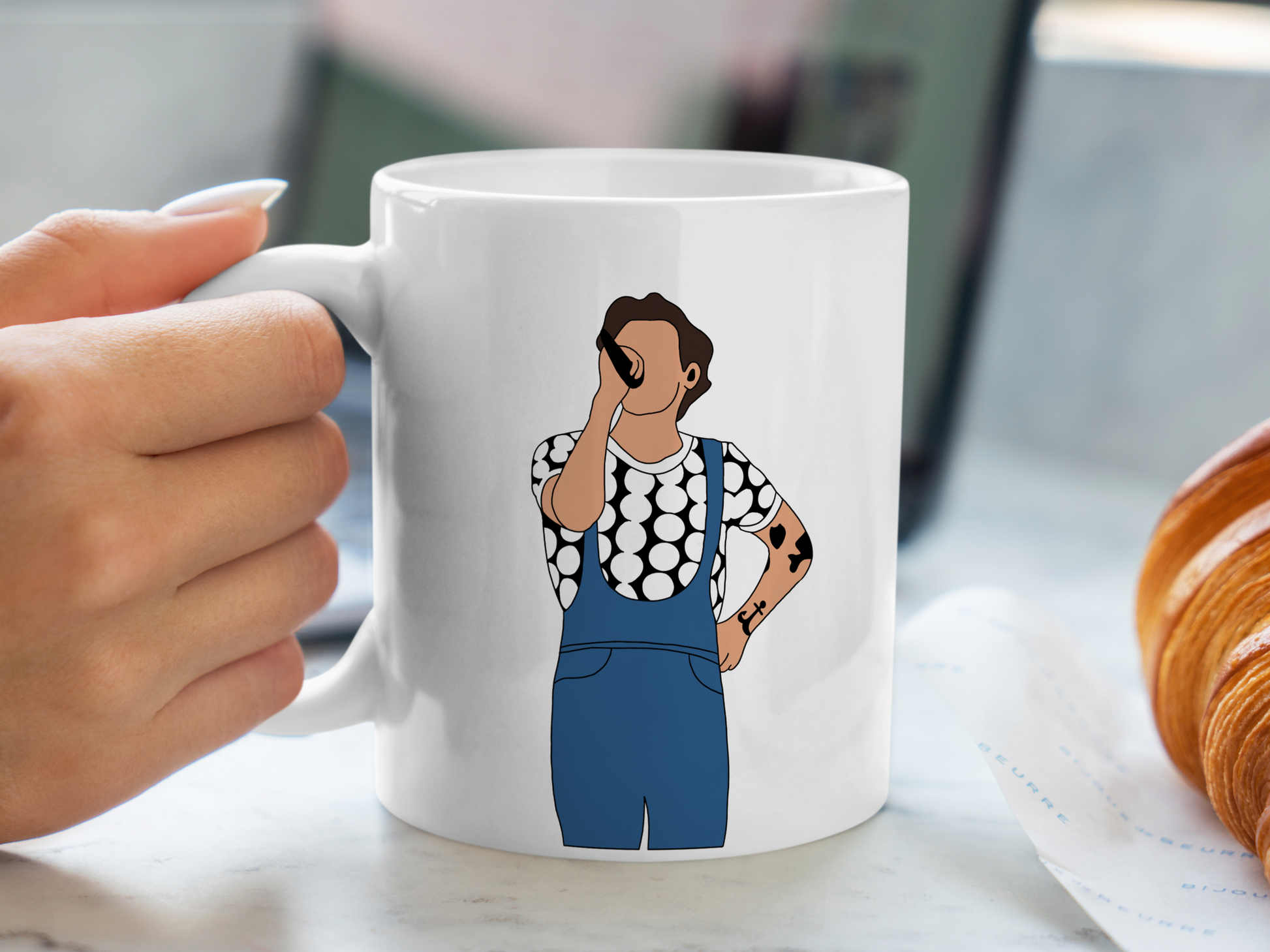 A white ceramic mug with a drawing of Harry Styles Manchester Love On Tour Outfit on the front. This is a 10oz mug which is perfect for fans of Harry Styles Love on Tour Concert. Made and sold by Krissi's Creations.