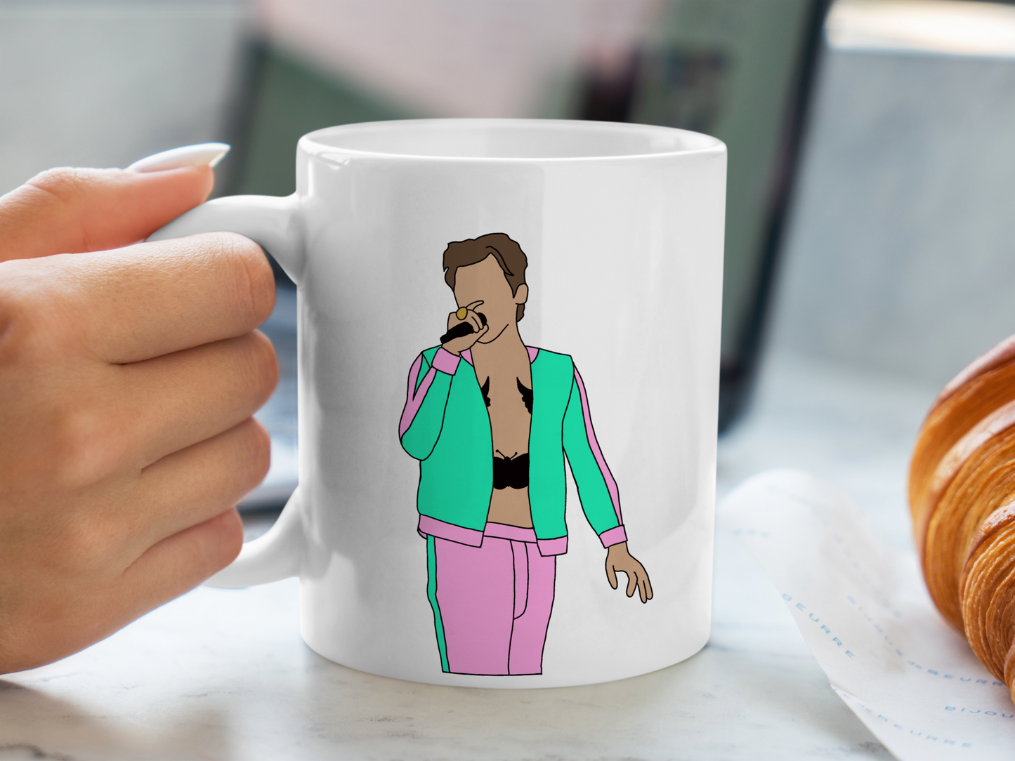 A white ceramic mug with a drawing of Harry Styles Coventry Night 2 Love On Tour Outfit on the front. This is a 10oz mug which is perfect for fans of Harry Styles Love on Tour Concert. Made and sold by Krissi's Creations.