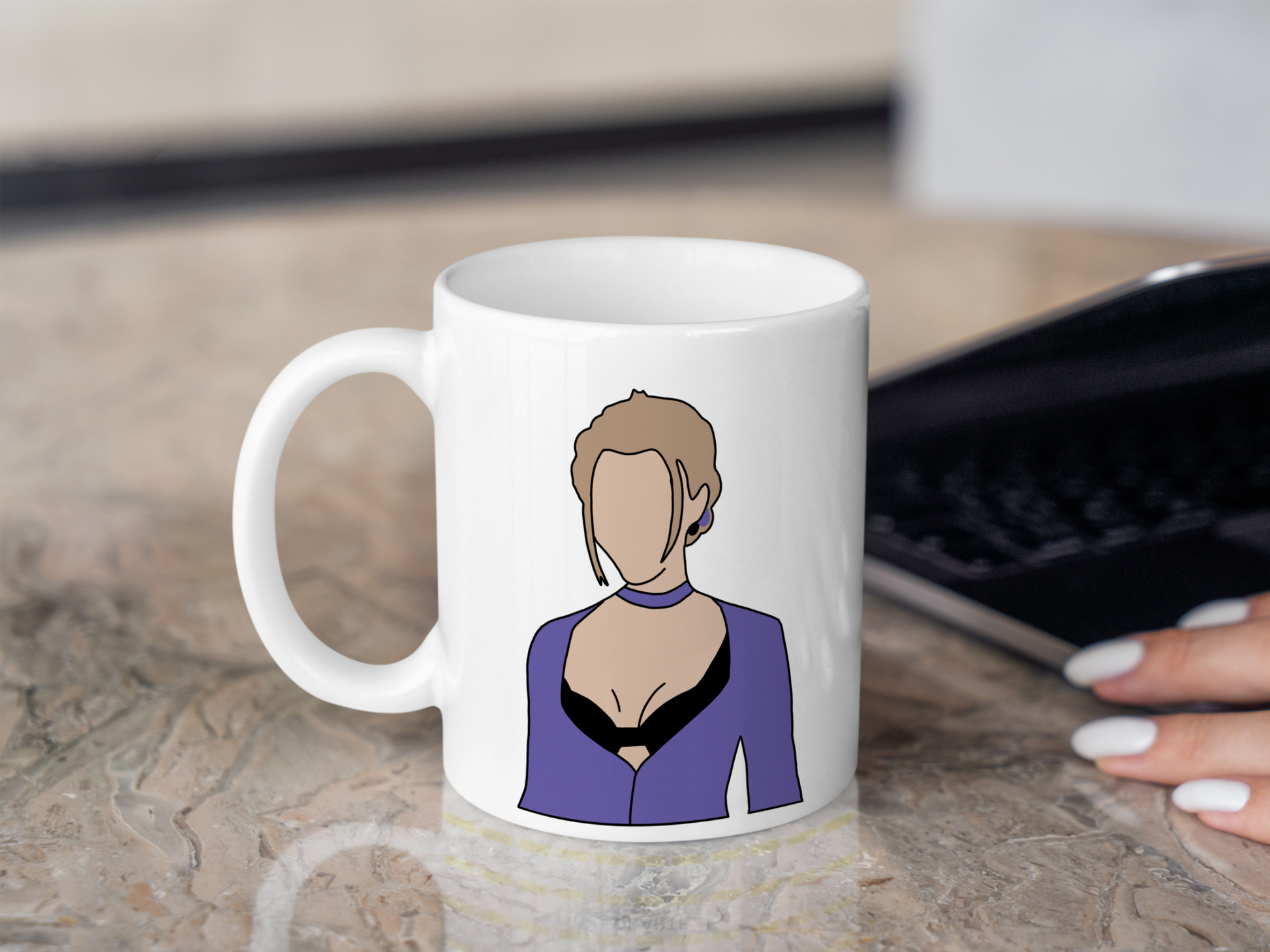 A white ceramic mug with a drawing of Phoebe Buffay from Friends on the front. This is a 10oz mug which is perfect for fans of Friends, particularly the character Phoebe. Made and sold by Krissi's Creations.