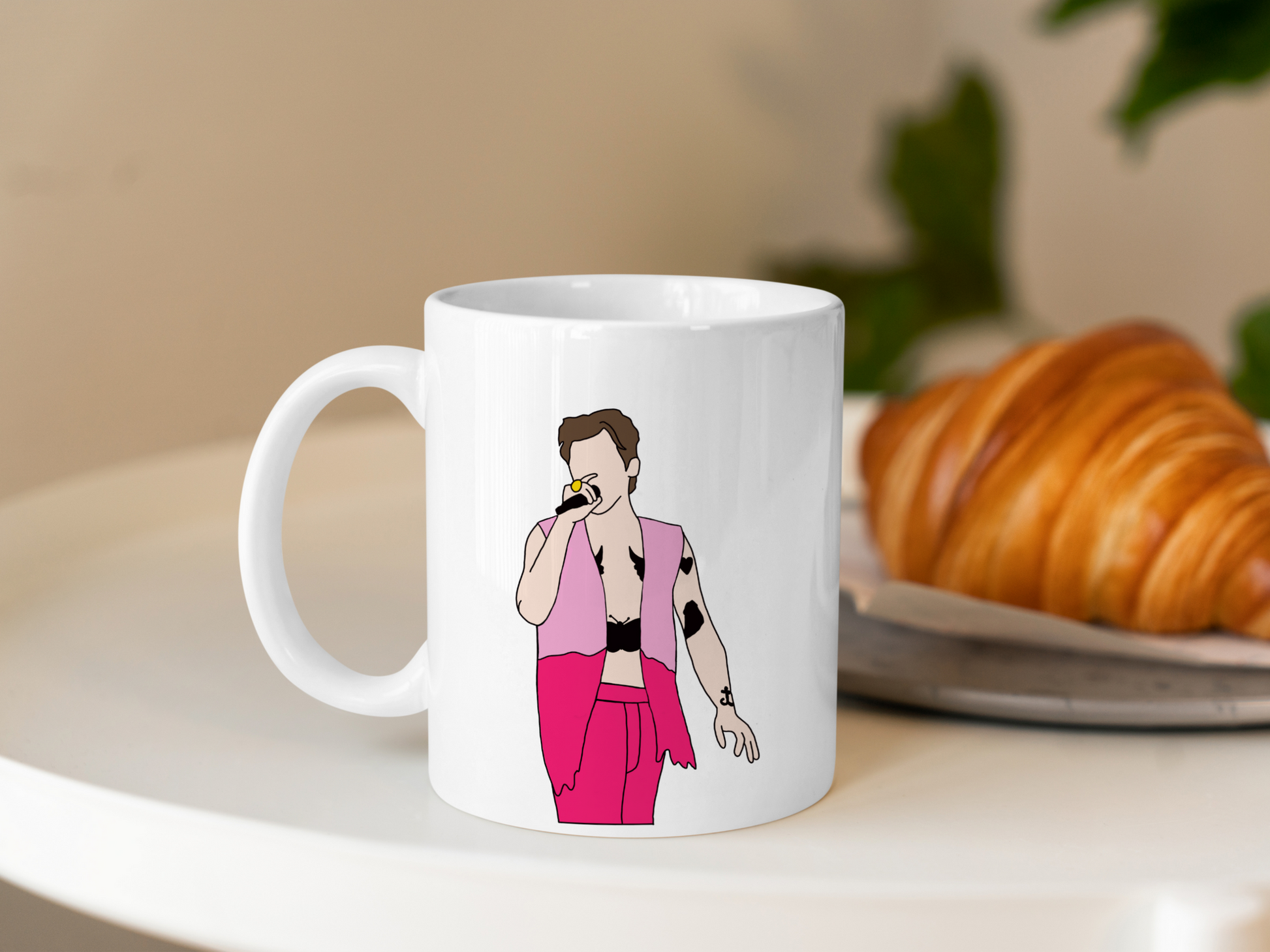 A white ceramic mug with a drawing of Harry Styles Edinburgh Night 2 Love On Tour Outfit on the front. This is a 10oz mug which is perfect for fans of Harry Styles Love on Tour Concert. Made and sold by Krissi's Creations.