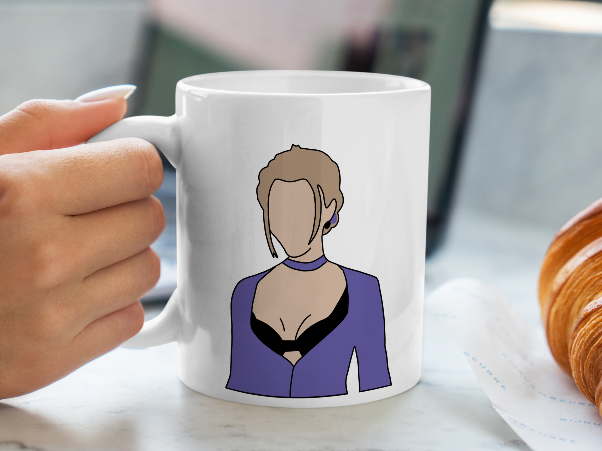 A white ceramic mug with a drawing of Phoebe Buffay from Friends on the front. This is a 10oz mug which is perfect for fans of Friends, particularly the character Phoebe. Made and sold by Krissi's Creations.