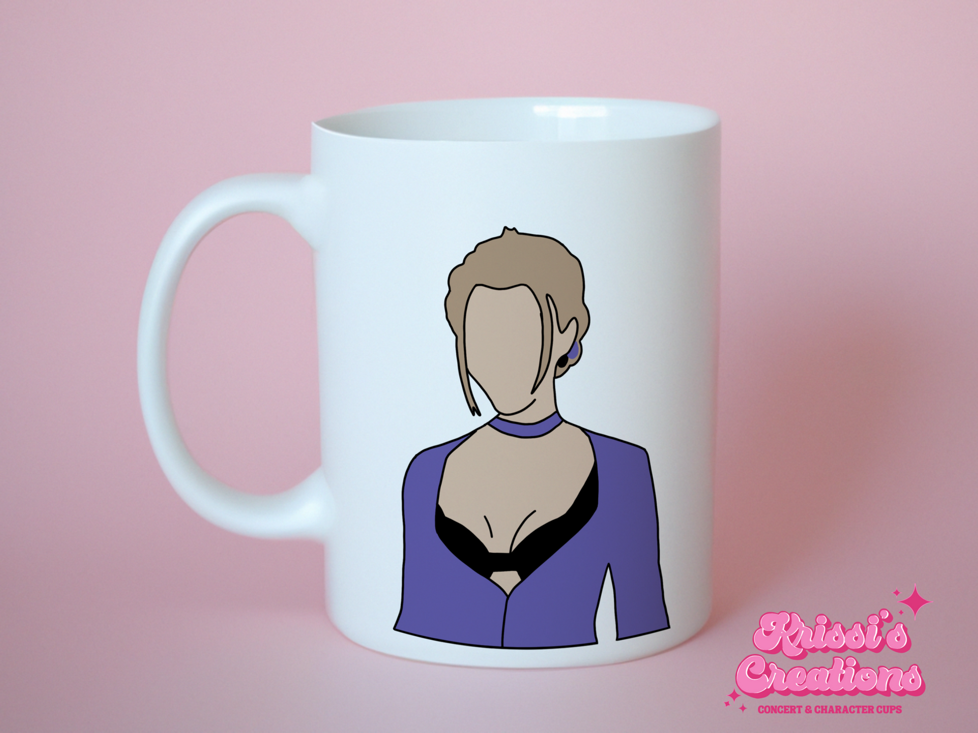 A white ceramic mug with a drawing of Phoebe Buffay from Friends on the front. This is a 10oz mug which is perfect for fans of Friends, particularly the character Phoebe. Made and sold by Krissi's Creations.