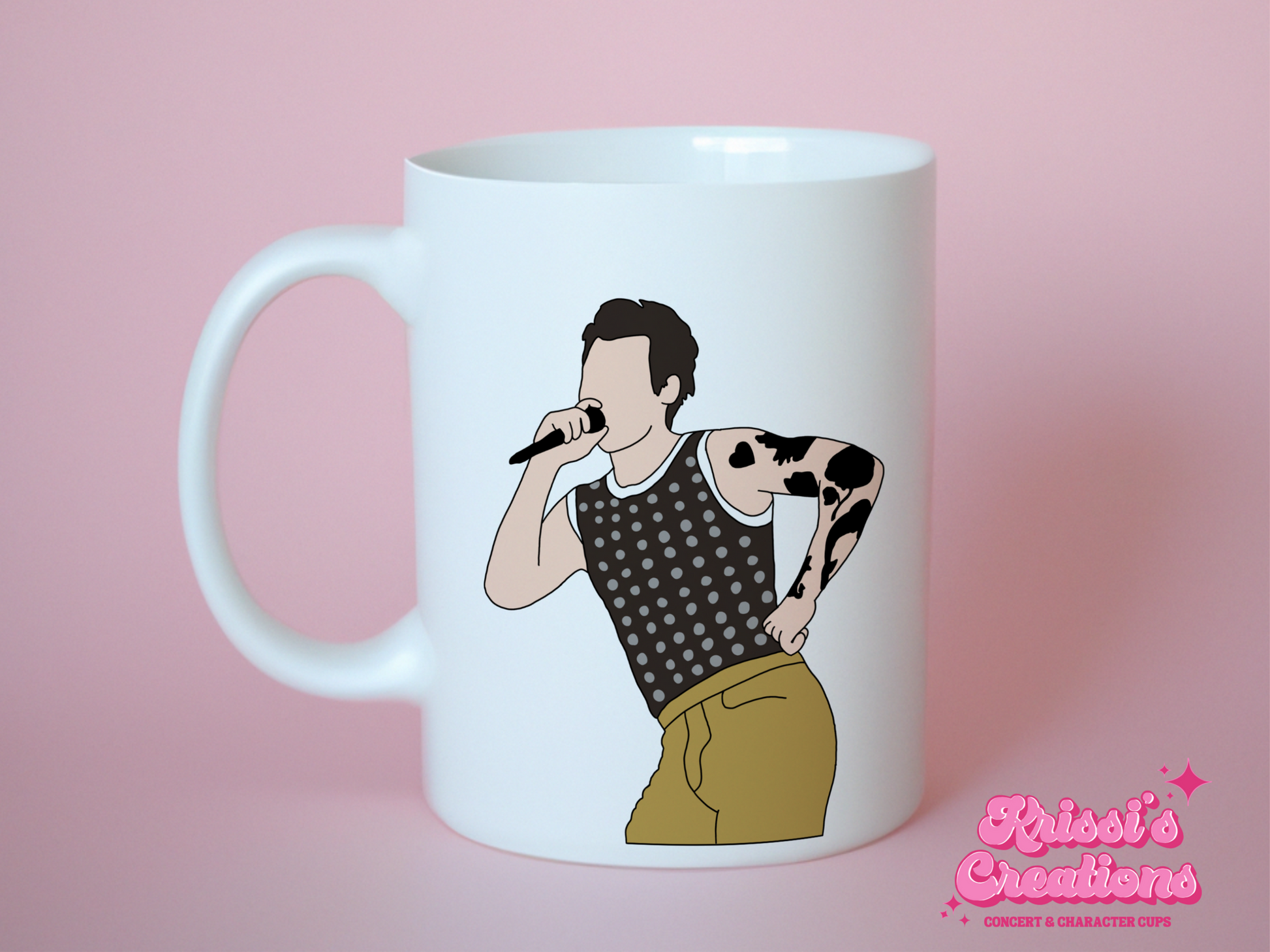 A white ceramic mug with a drawing of Harry Styles Cardiff Night 1 Outfit on the front. This is a 10oz mug which is perfect for fans of Harry Styles Love on Tour Concert. Made and sold by Krissi's Creations.