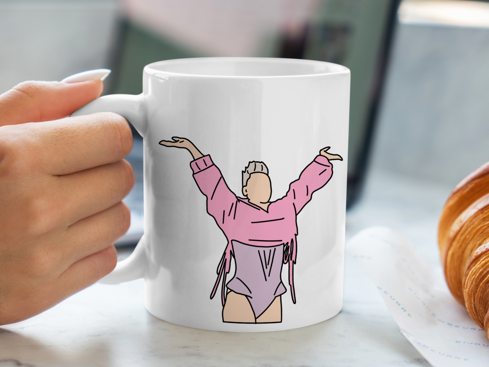 A white ceramic mug with a drawing of P!NK from her Summer Carnival 2024 on the front. This is a 10oz mug which is perfect for fans of Pink, particularly the Concert. Made and sold by Krissi's Creations.