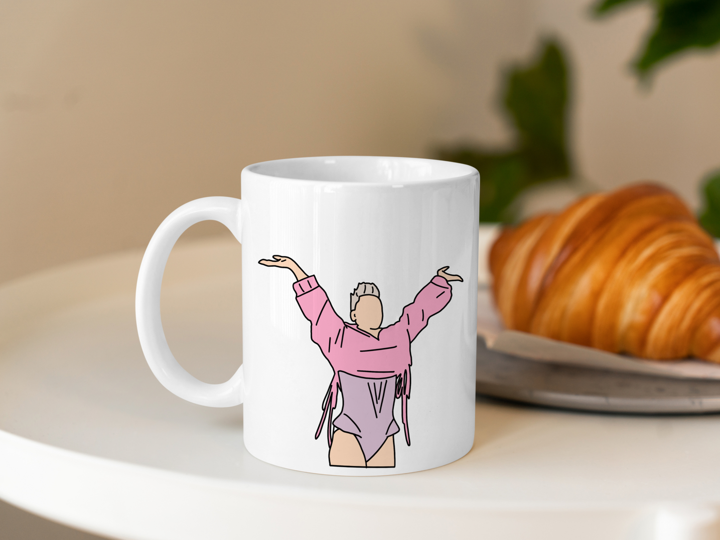 A white ceramic mug with a drawing of P!NK from her Summer Carnival 2024 on the front. This is a 10oz mug which is perfect for fans of Pink, particularly the Concert. Made and sold by Krissi's Creations.