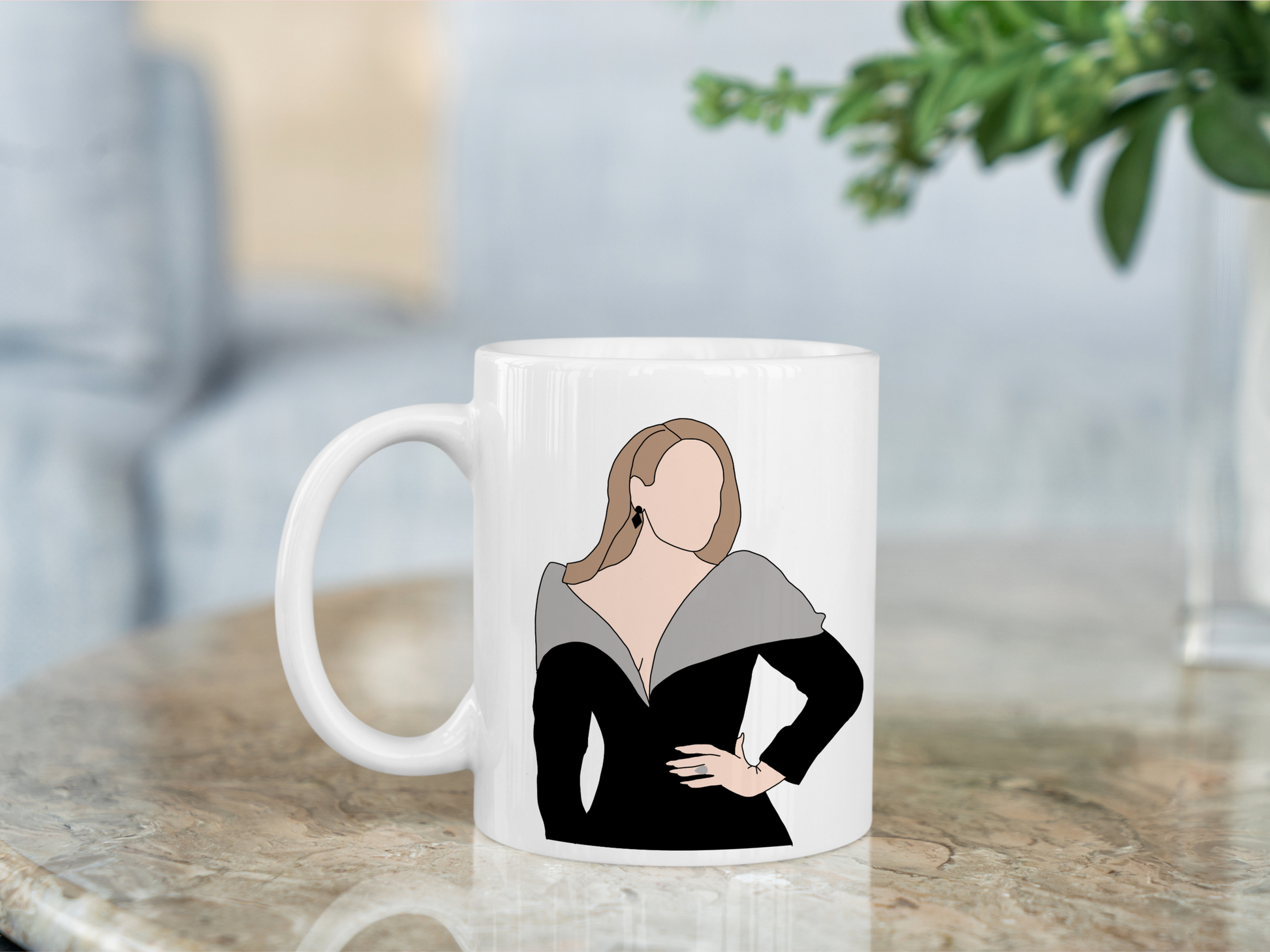 A white ceramic mug with a drawing of Adele on the front. This is a 10oz mug which is perfect for fans of Adele Vegas Residency Concerts. Made and sold by Krissi's Creations.