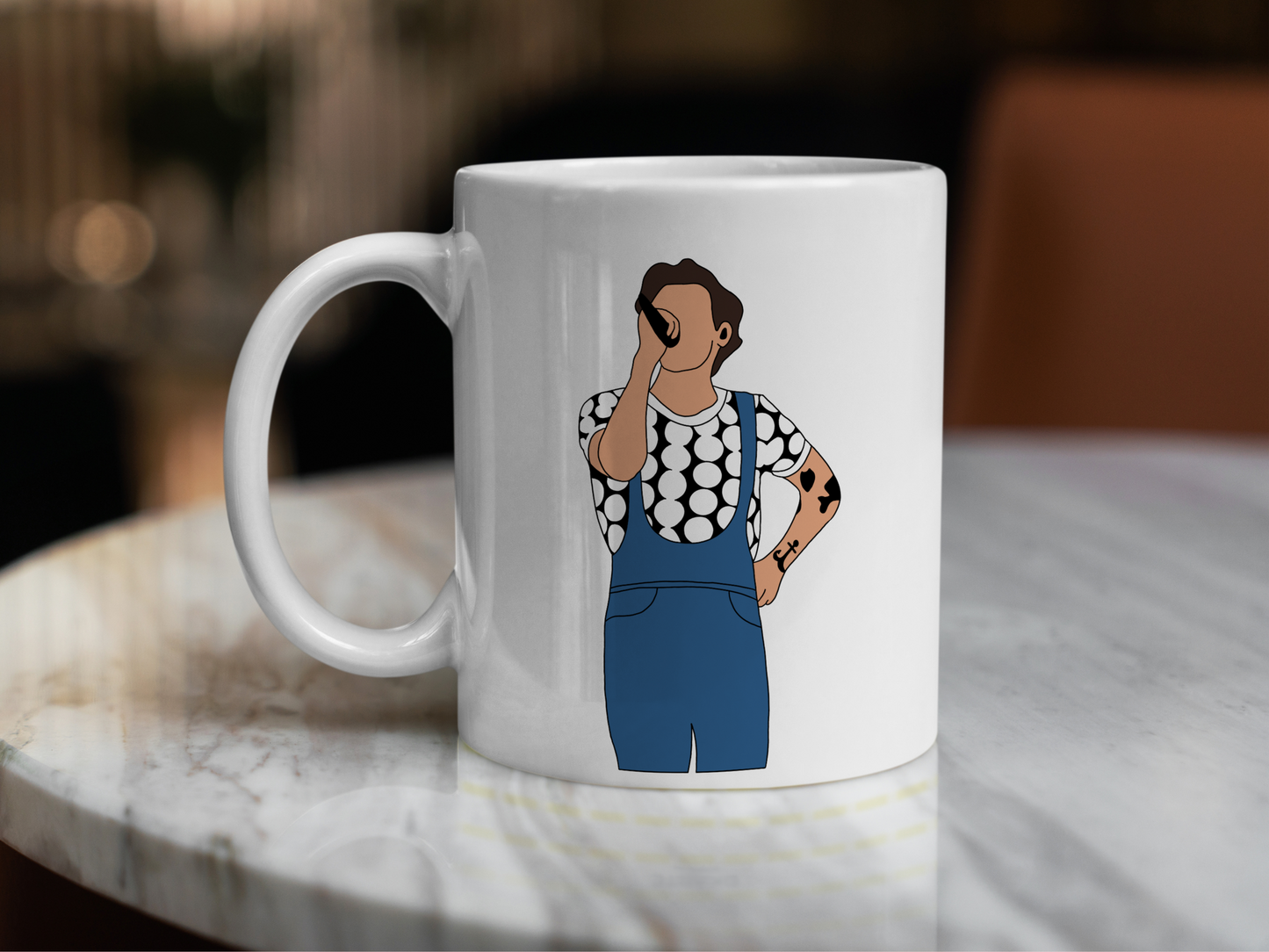 A white ceramic mug with a drawing of Harry Styles Manchester Love On Tour Outfit on the front. This is a 10oz mug which is perfect for fans of Harry Styles Love on Tour Concert. Made and sold by Krissi's Creations.