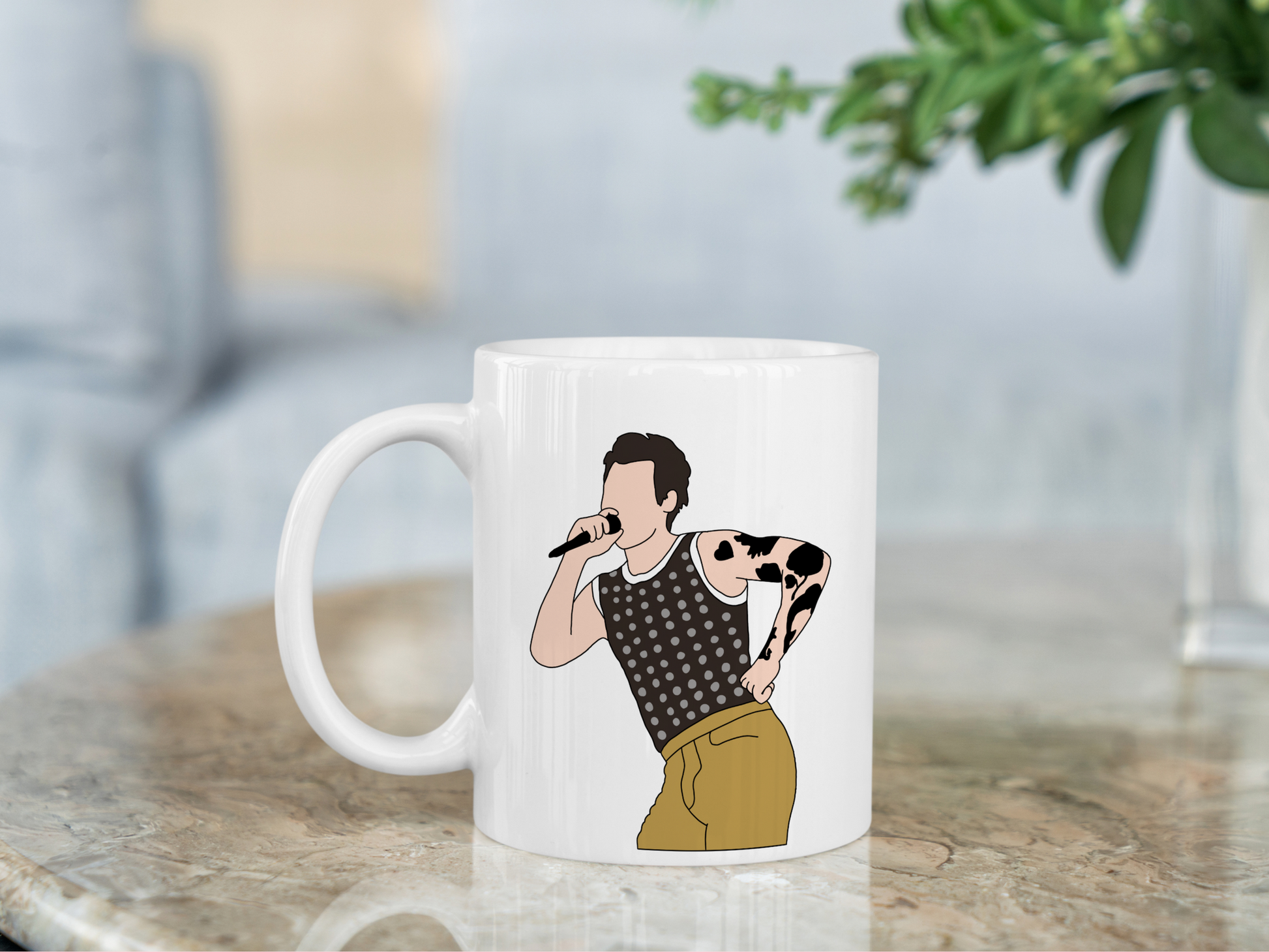 A white ceramic mug with a drawing of Harry Styles Cardiff Night 1 Outfit on the front. This is a 10oz mug which is perfect for fans of Harry Styles Love on Tour Concert. Made and sold by Krissi's Creations.