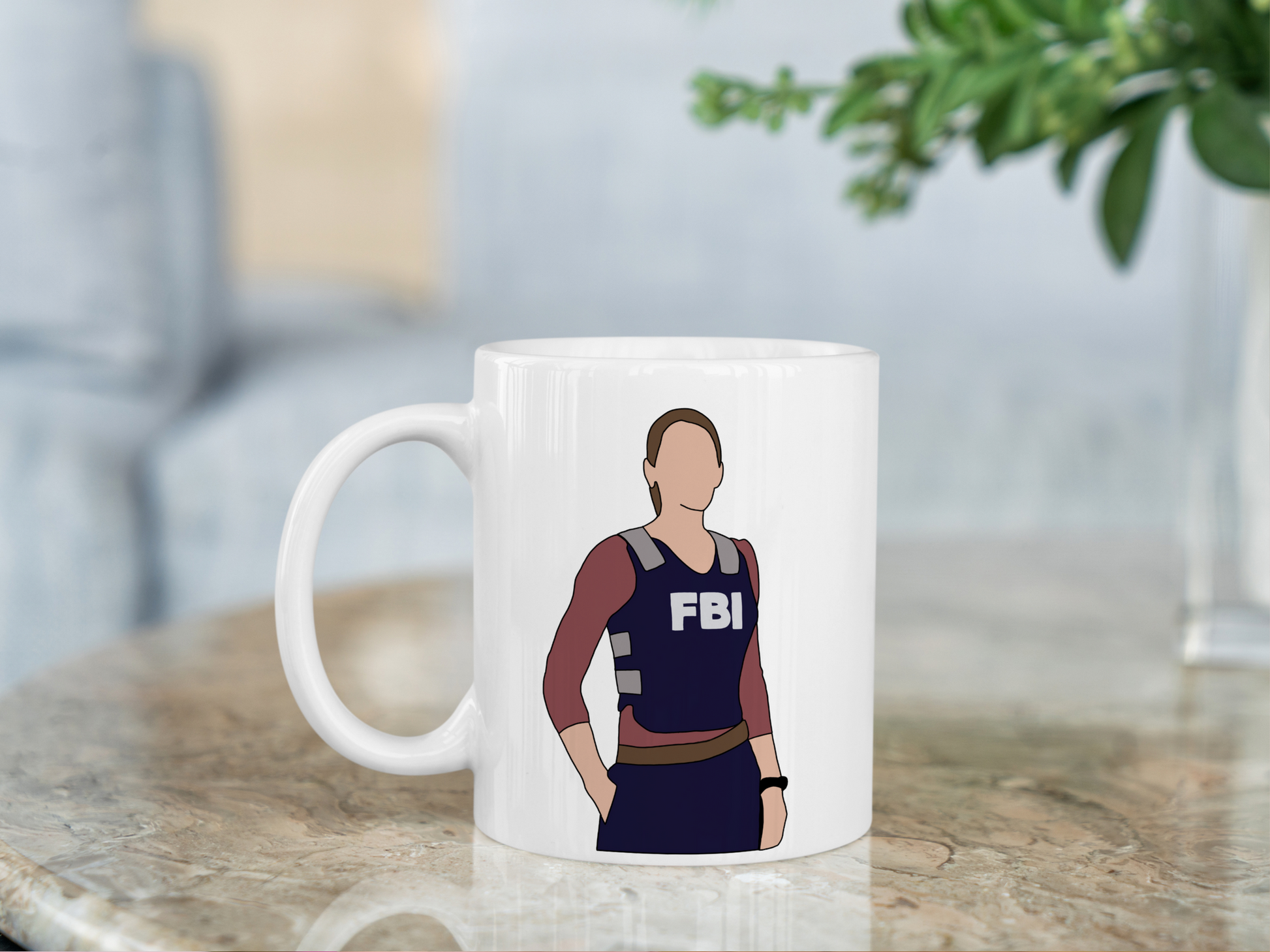 A white ceramic mug with a drawing of Emily Prentiss from Criminal Minds on the front. This is a 10oz mug which is perfect for fans of Criminal Minds, particularly the character Emily Prentiss. Made and sold by Krissi's Creations.