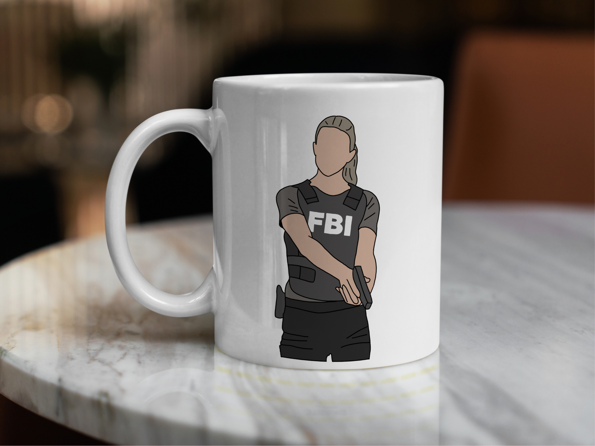 A white ceramic mug with a drawing of Jennifer Jareau from Criminal Minds on the front. This is a 10oz mug which is perfect for fans of Criminal Minds, particularly the character Jennifer Jareau. Made and sold by Krissi's Creations.