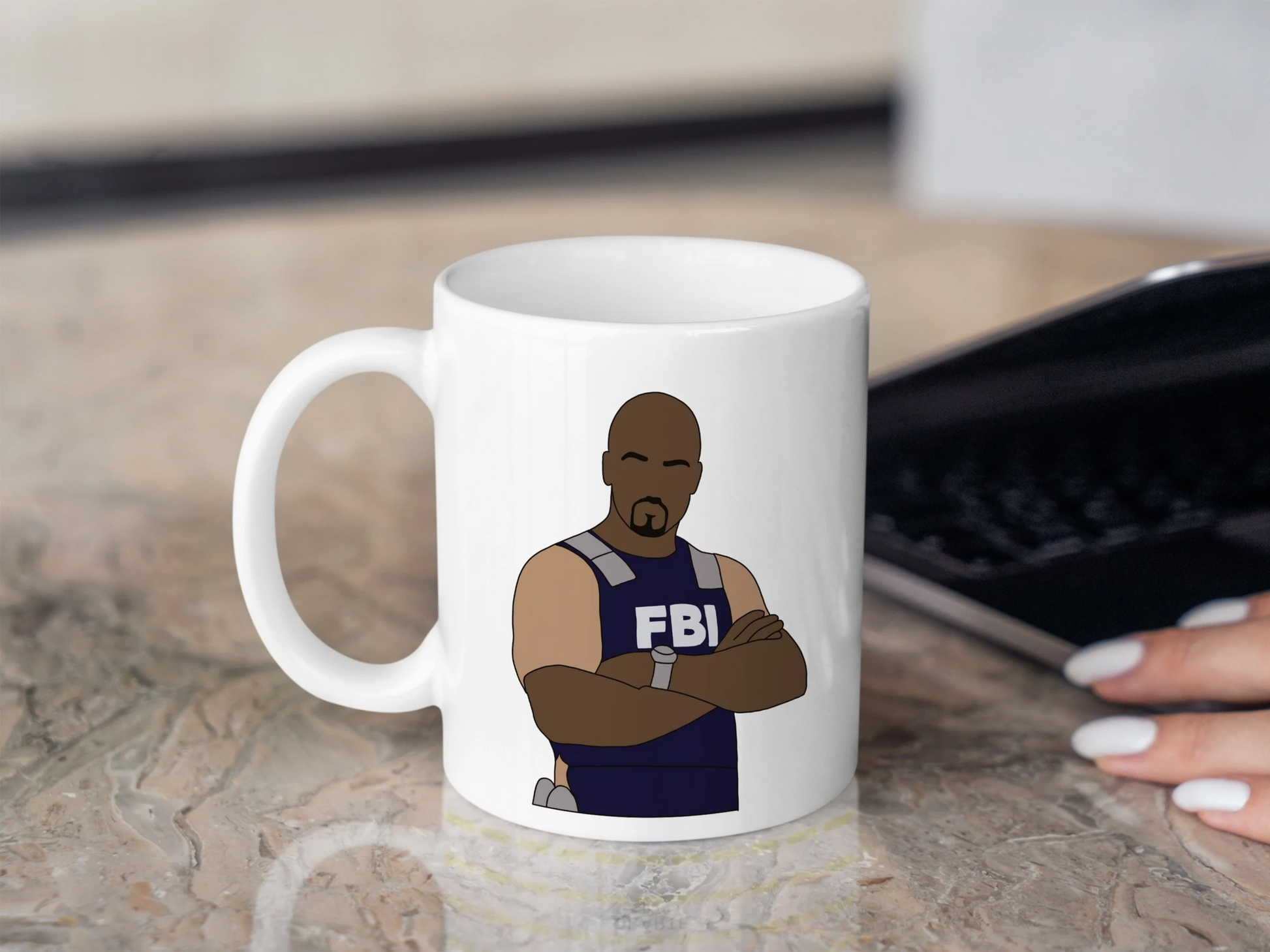 A white ceramic mug with a drawing of Derek Morgan from Criminal Minds on the front. This is a 10oz mug which is perfect for fans of Criminal Minds, particularly the character Derek Morgan. Made and sold by Krissi's Creations.