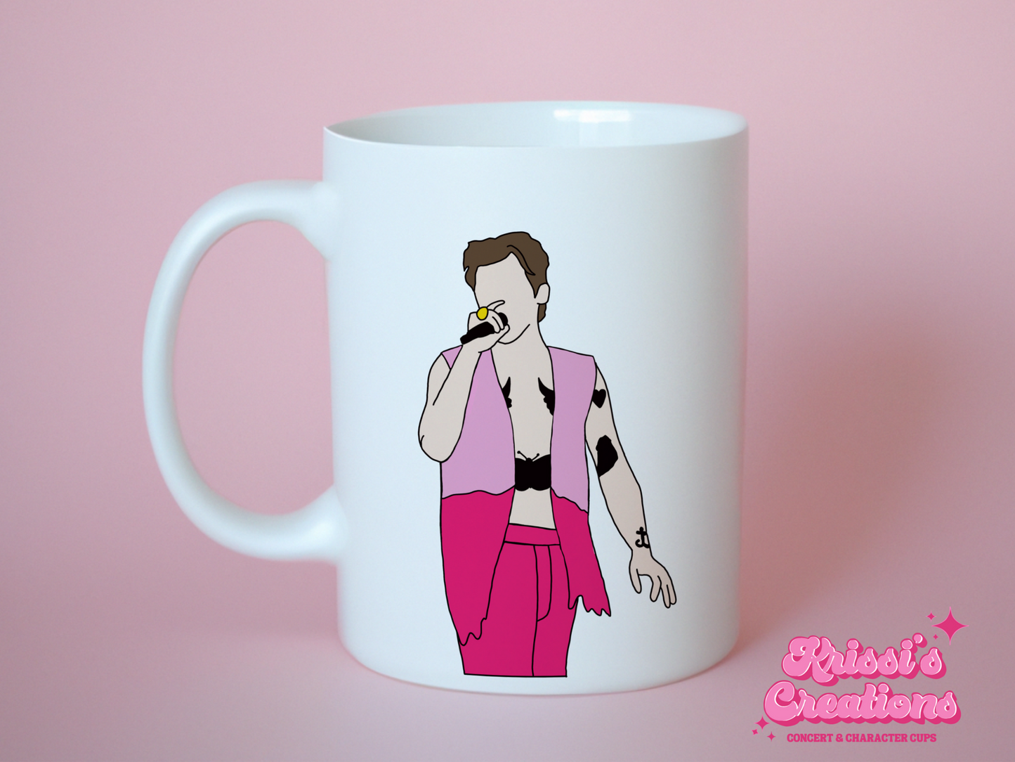 A white ceramic mug with a drawing of Harry Styles Edinburgh Night 2 Love On Tour Outfit on the front. This is a 10oz mug which is perfect for fans of Harry Styles Love on Tour Concert. Made and sold by Krissi's Creations.