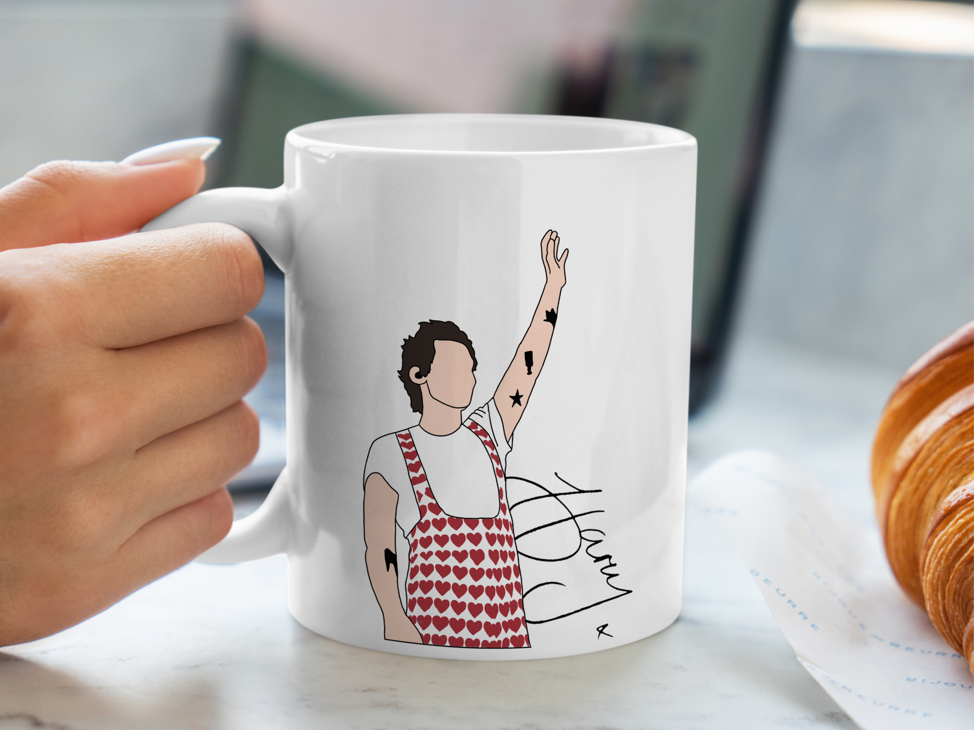 A white ceramic mug with a drawing of Harry Styles Wembley Love On Tour Outfit on the front. This is a 10oz mug which is perfect for fans of Harry Styles Love on Tour Concert. Made and sold by Krissi's Creations.