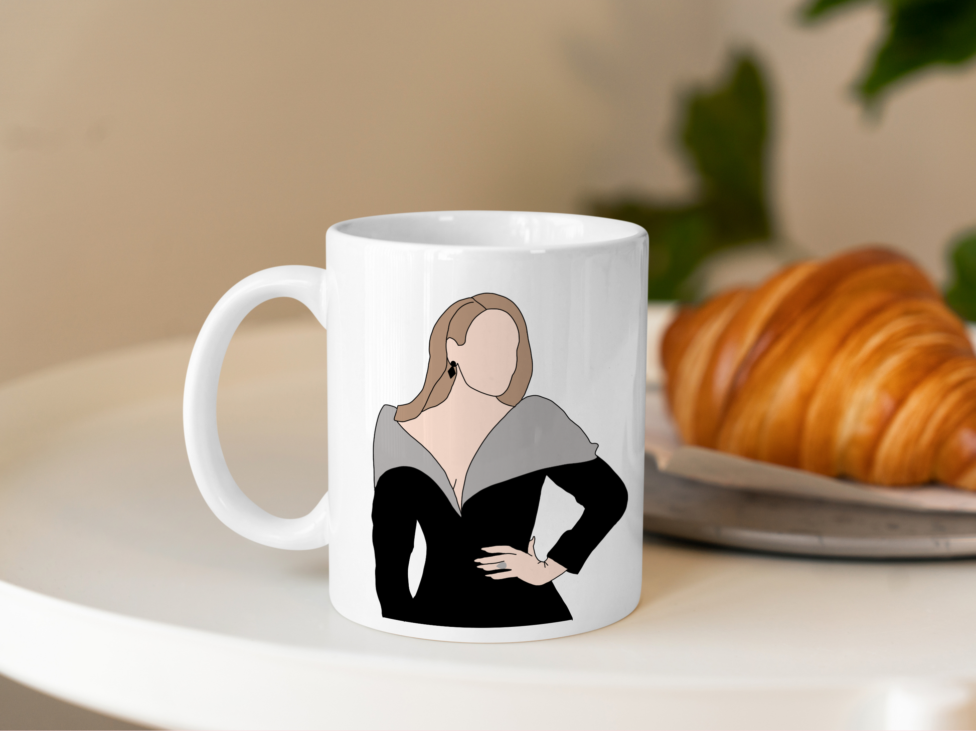 A white ceramic mug with a drawing of Adele on the front. This is a 10oz mug which is perfect for fans of Adele Vegas Residency Concerts. Made and sold by Krissi's Creations.