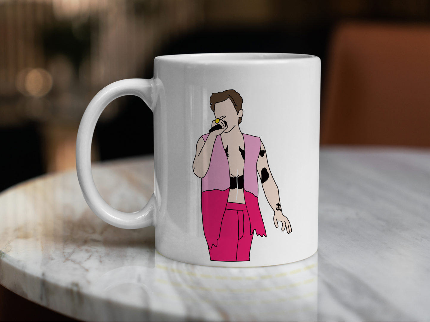 A white ceramic mug with a drawing of Harry Styles Edinburgh Night 2 Love On Tour Outfit on the front. This is a 10oz mug which is perfect for fans of Harry Styles Love on Tour Concert. Made and sold by Krissi's Creations.