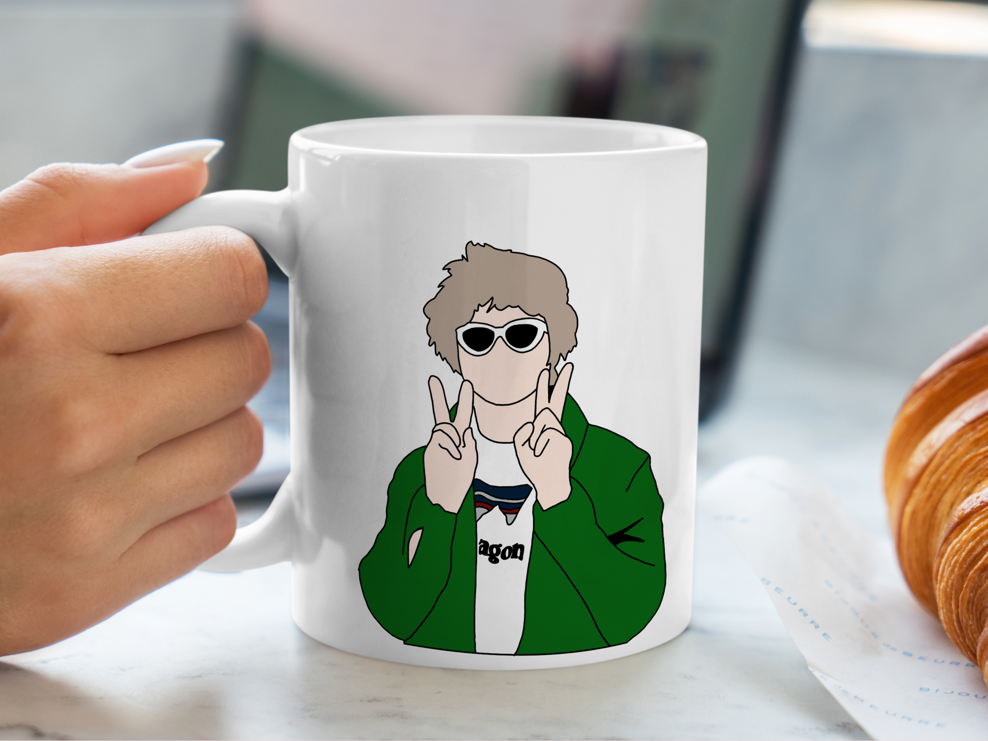 A white ceramic mug with a drawing of Lewis Capaldi on the front. This is a 10oz mug which is perfect for fans of Lewis Capaldi Concerts. Made and sold by Krissi's Creations.