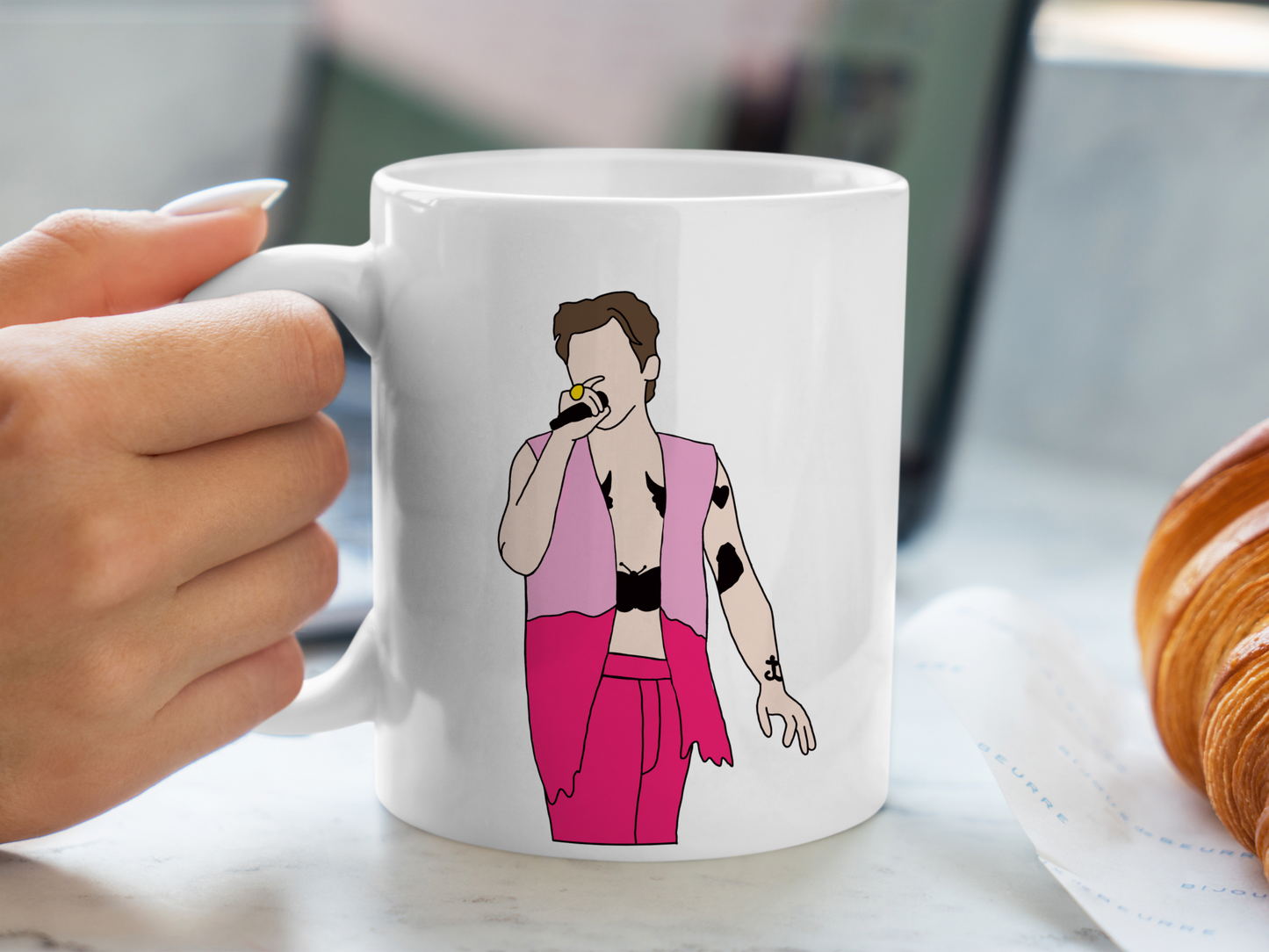 A white ceramic mug with a drawing of Harry Styles Edinburgh Night 2 Love On Tour Outfit on the front. This is a 10oz mug which is perfect for fans of Harry Styles Love on Tour Concert. Made and sold by Krissi's Creations.