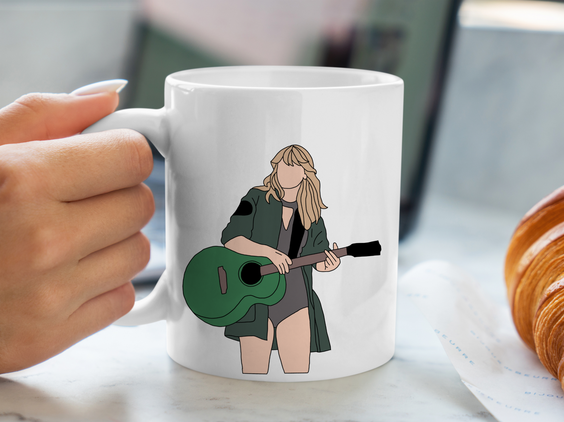 A white ceramic mug with a drawing of Taylor Swift from her Reputation Era on the front. This is a 10oz mug which is perfect for fans of Era's Tour, particularly the Reputation Album. Made and sold by Krissi's Creations.