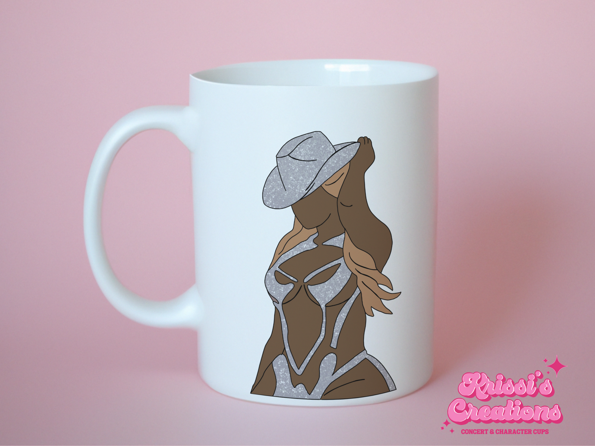 A white ceramic mug with a drawing of Beyonce on the front. This is a 10oz mug which is perfect for fans of Beyonce Renaissance Tour Concerts. Made and sold by Krissi's Creations.