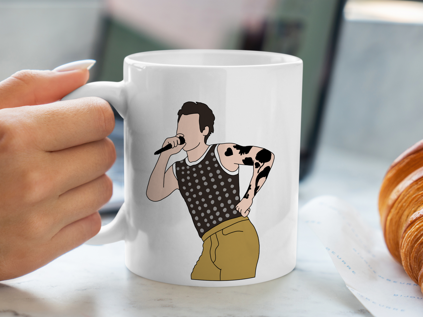 A white ceramic mug with a drawing of Harry Styles Cardiff Night 1 Outfit on the front. This is a 10oz mug which is perfect for fans of Harry Styles Love on Tour Concert. Made and sold by Krissi's Creations.