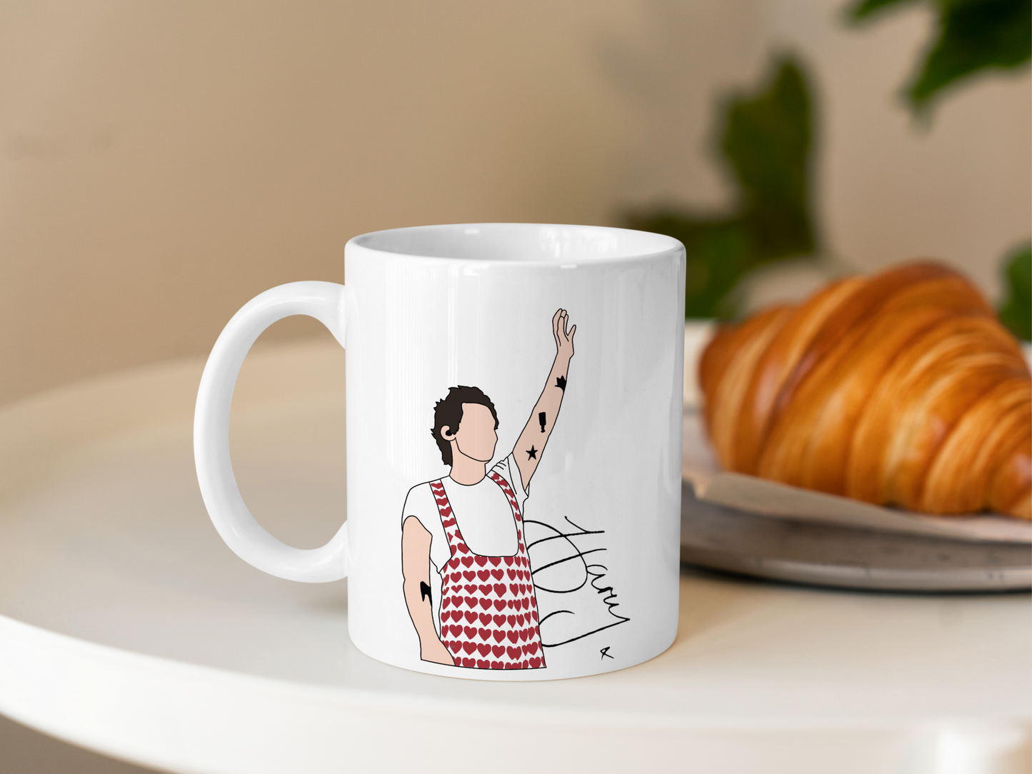 A white ceramic mug with a drawing of Harry Styles Wembley Love On Tour Outfit on the front. This is a 10oz mug which is perfect for fans of Harry Styles Love on Tour Concert. Made and sold by Krissi's Creations.