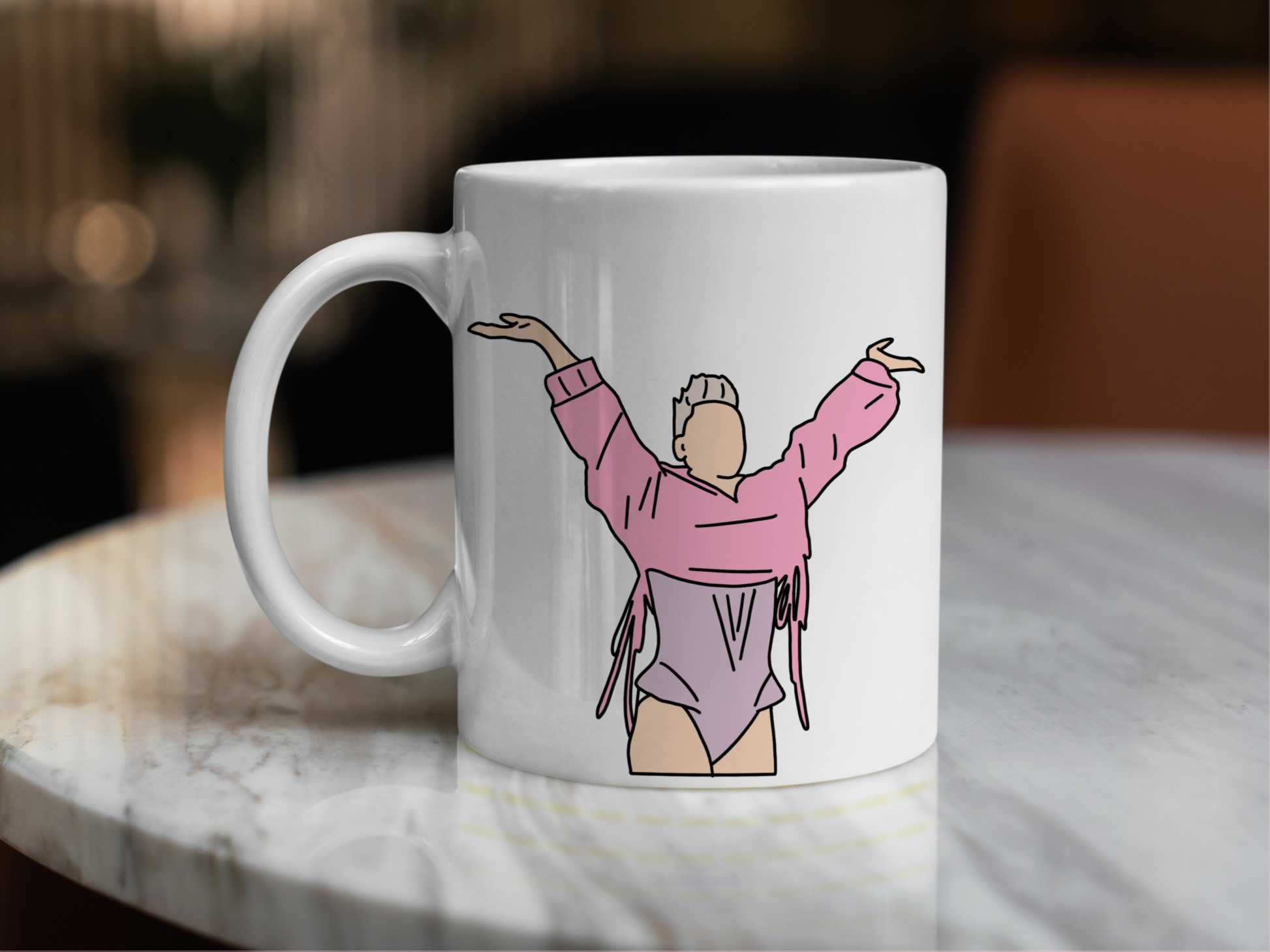 A white ceramic mug with a drawing of P!NK from her Summer Carnival 2024 on the front. This is a 10oz mug which is perfect for fans of Pink, particularly the Concert. Made and sold by Krissi's Creations.