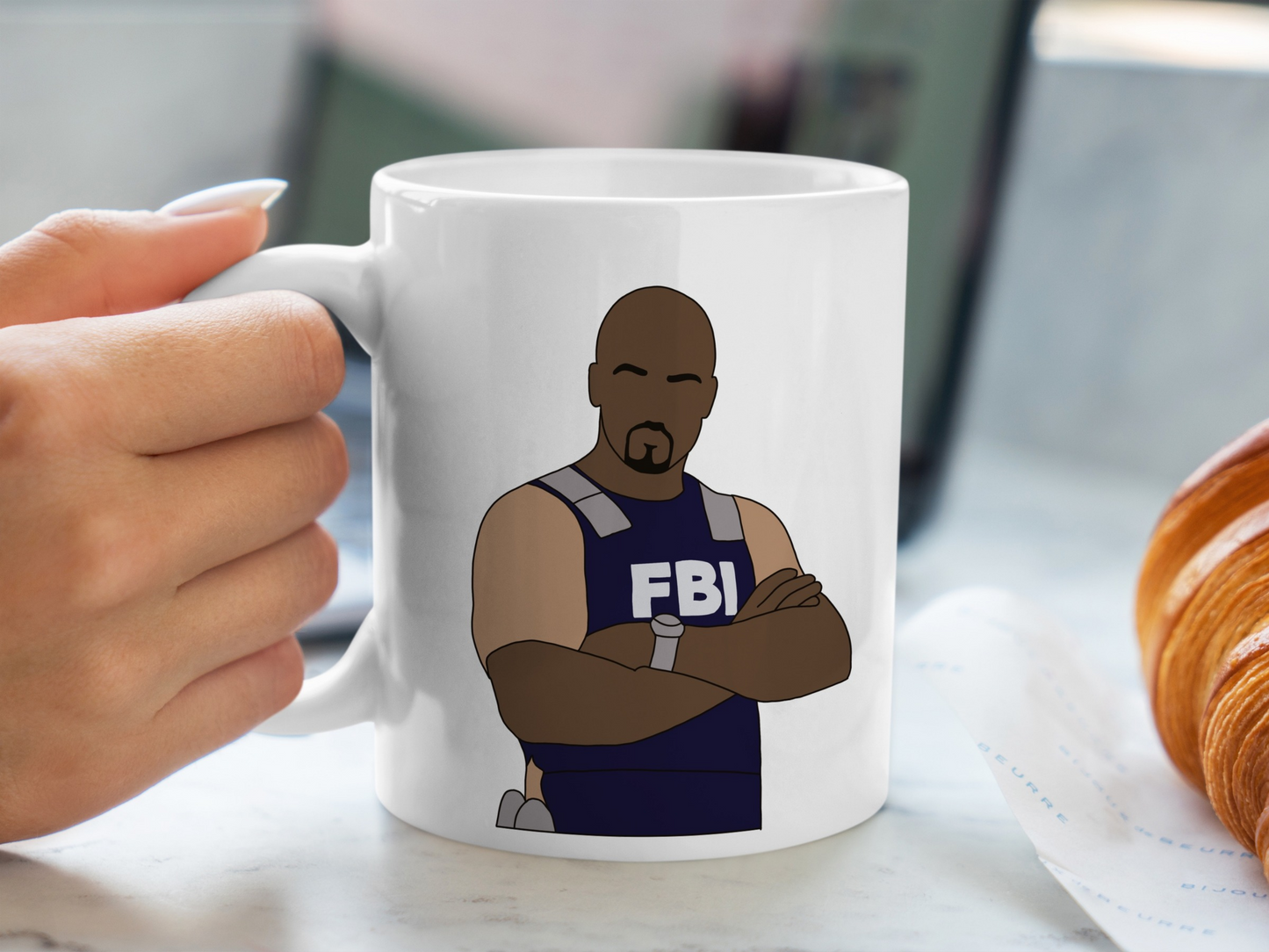 A white ceramic mug with a drawing of Derek Morgan from Criminal Minds on the front. This is a 10oz mug which is perfect for fans of Criminal Minds, particularly the character Derek Morgan. Made and sold by Krissi's Creations.