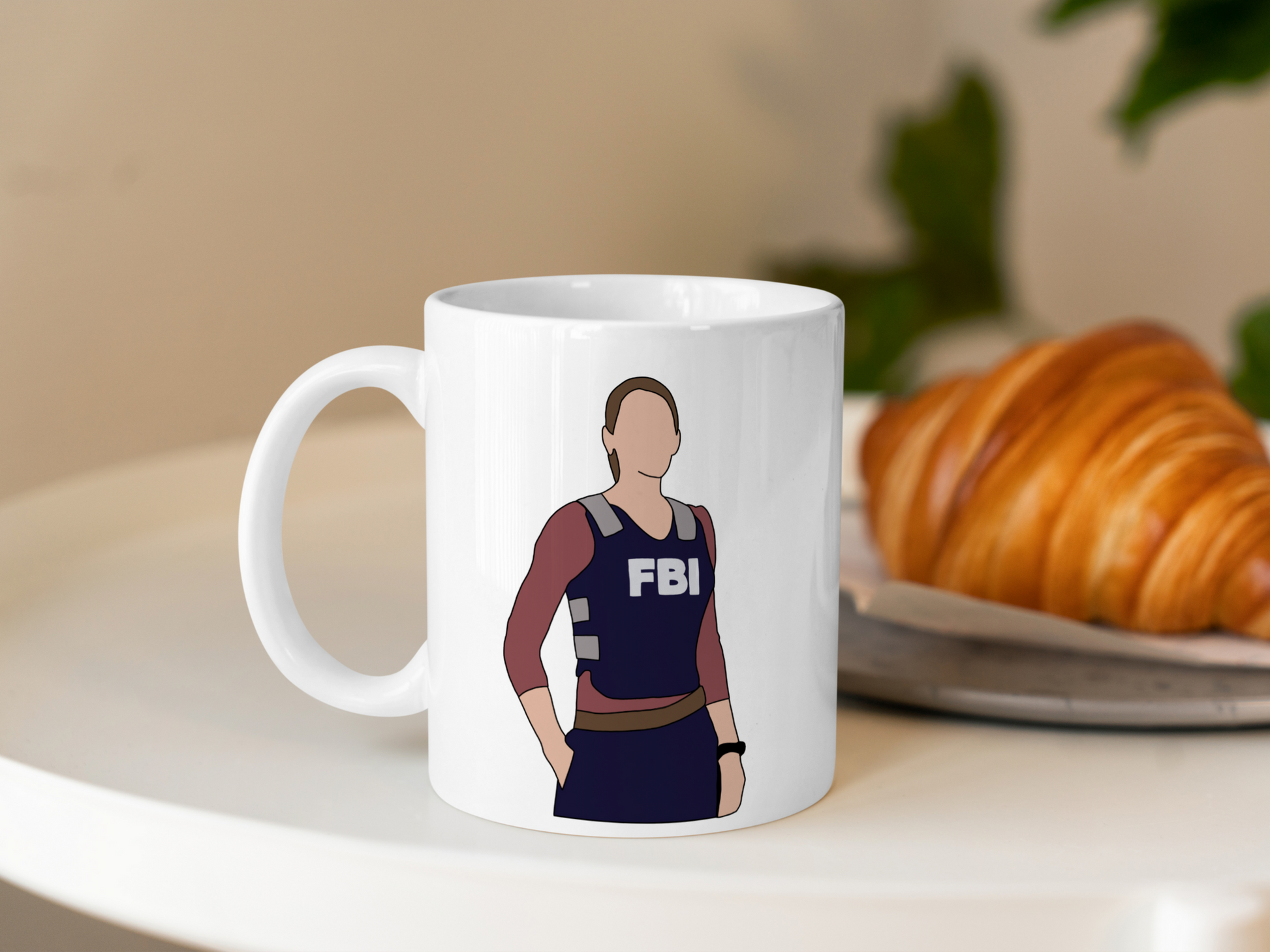 A white ceramic mug with a drawing of Emily Prentiss from Criminal Minds on the front. This is a 10oz mug which is perfect for fans of Criminal Minds, particularly the character Emily Prentiss. Made and sold by Krissi's Creations.