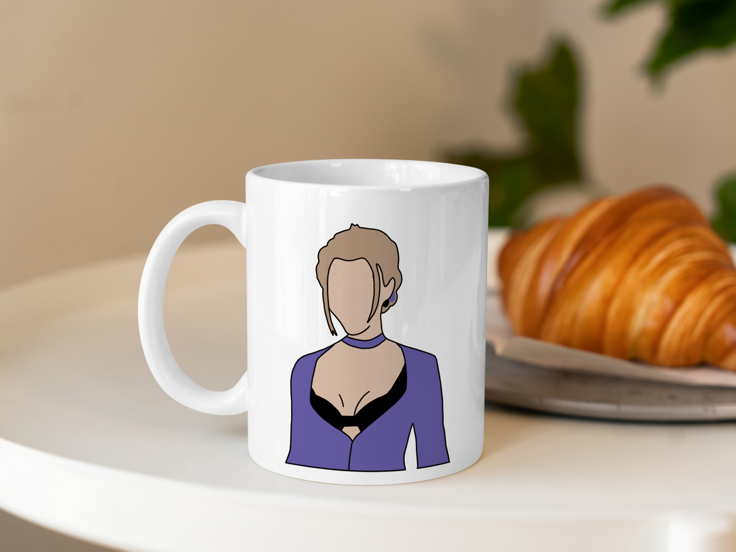 A white ceramic mug with a drawing of Phoebe Buffay from Friends on the front. This is a 10oz mug which is perfect for fans of Friends, particularly the character Phoebe. Made and sold by Krissi's Creations.