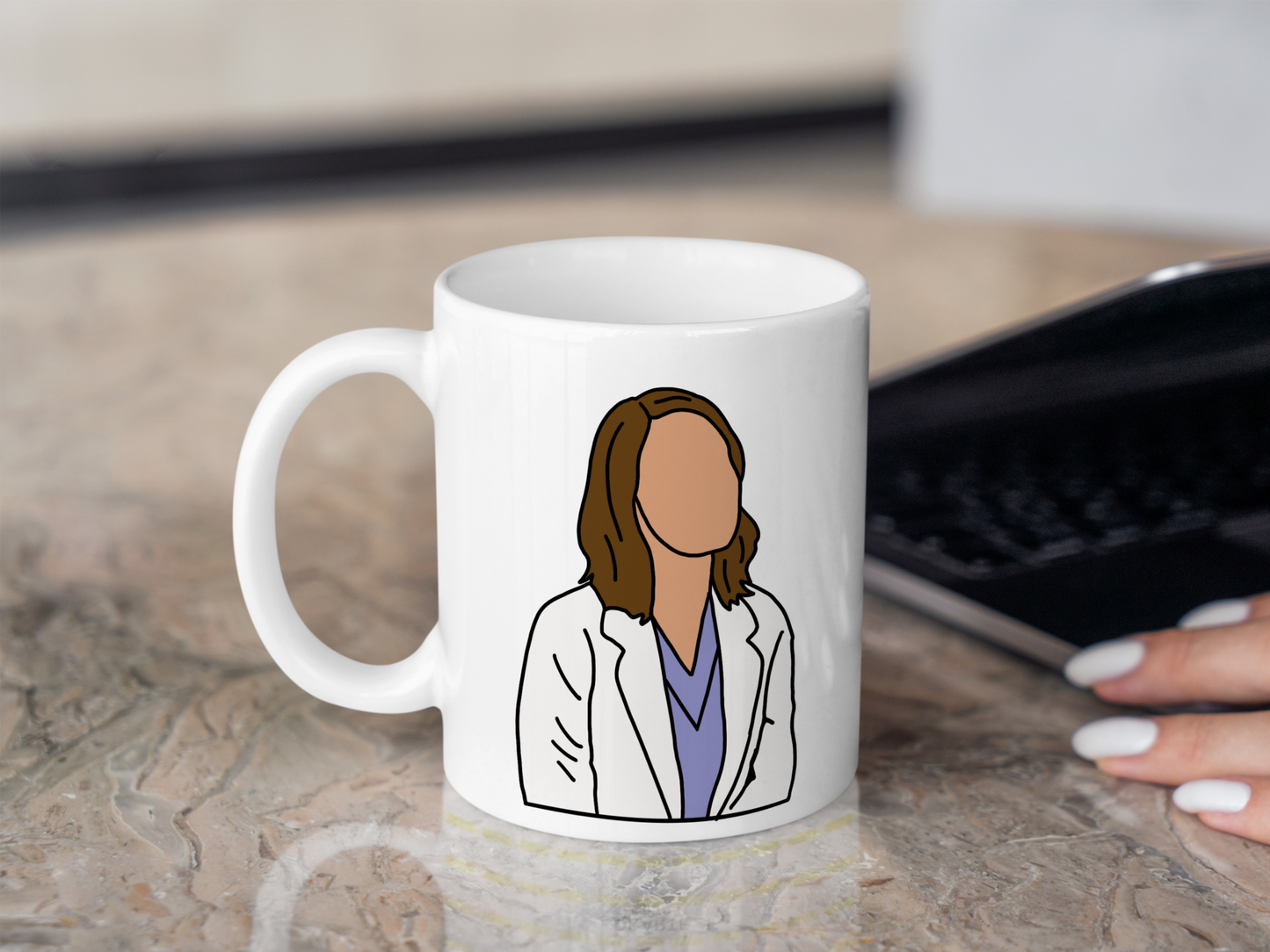 A white ceramic mug with a drawing of Jo Wilson from Grey's Anatomy on the front. This is a 10oz mug which is perfect for fans of Grey's Anatomy, particularly the character Jo Wilson. Made and sold by Krissi's Creations.