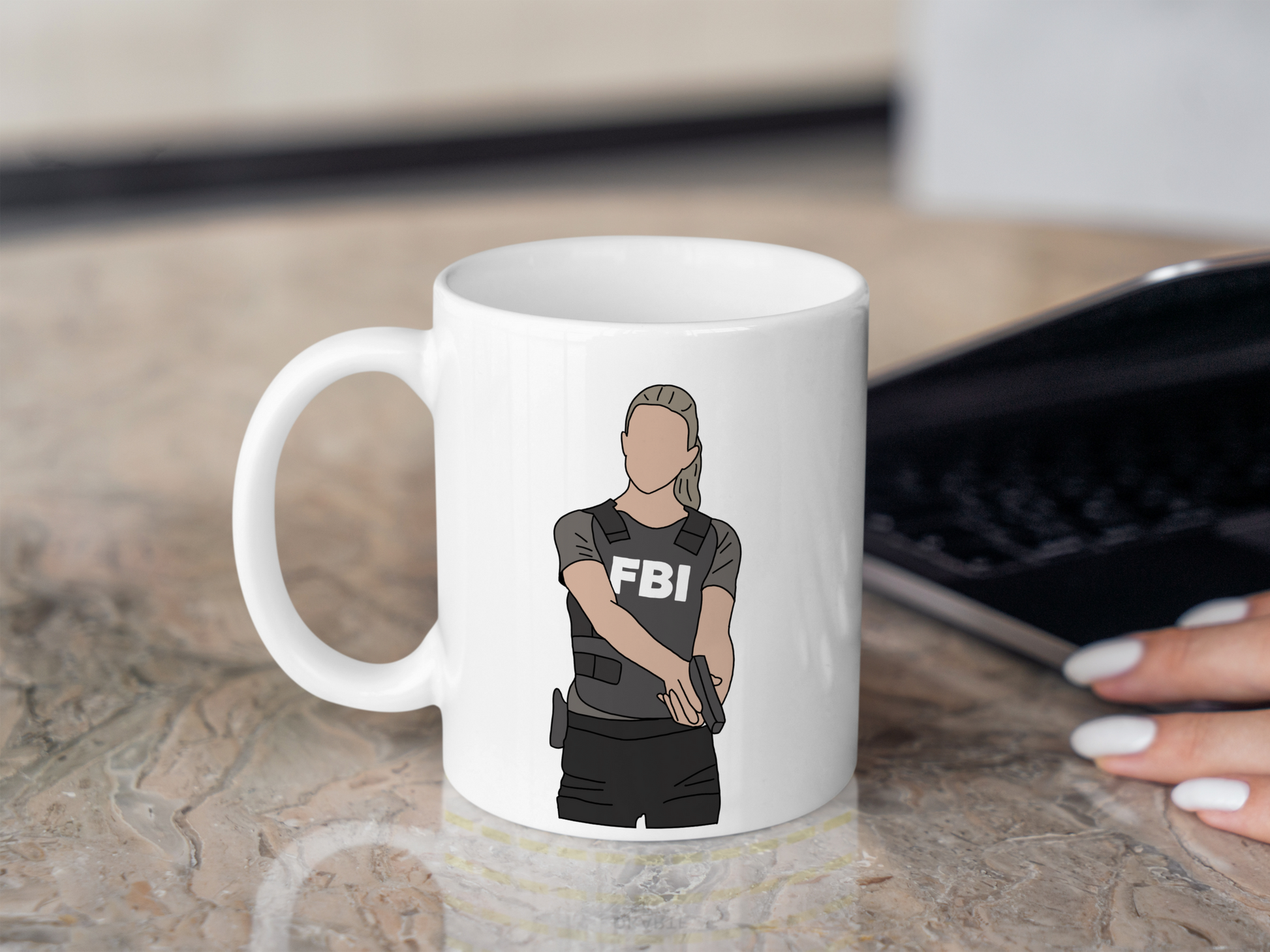 A white ceramic mug with a drawing of Jennifer Jareau from Criminal Minds on the front. This is a 10oz mug which is perfect for fans of Criminal Minds, particularly the character Jennifer Jareau. Made and sold by Krissi's Creations.