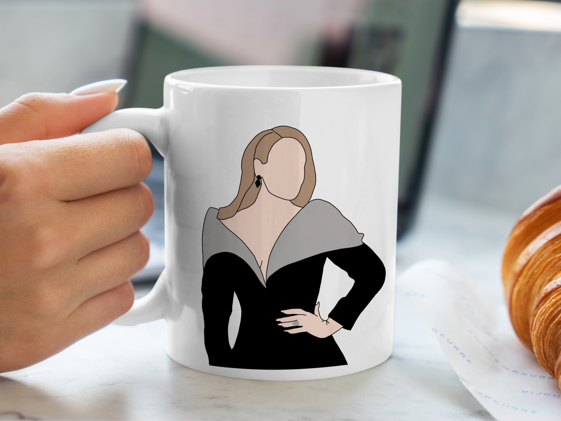 A white ceramic mug with a drawing of Adele on the front. This is a 10oz mug which is perfect for fans of Adele Vegas Residency Concerts. Made and sold by Krissi's Creations.