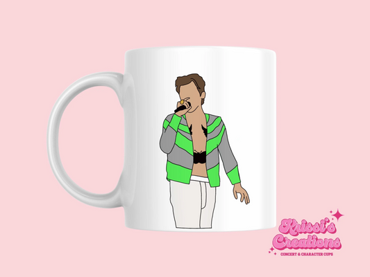 A white ceramic mug with a drawing of Harry Styles Slane Love On Tour Outfit on the front. This is a 10oz mug which is perfect for fans of Harry Styles Love on Tour Concert. Made and sold by Krissi's Creations.