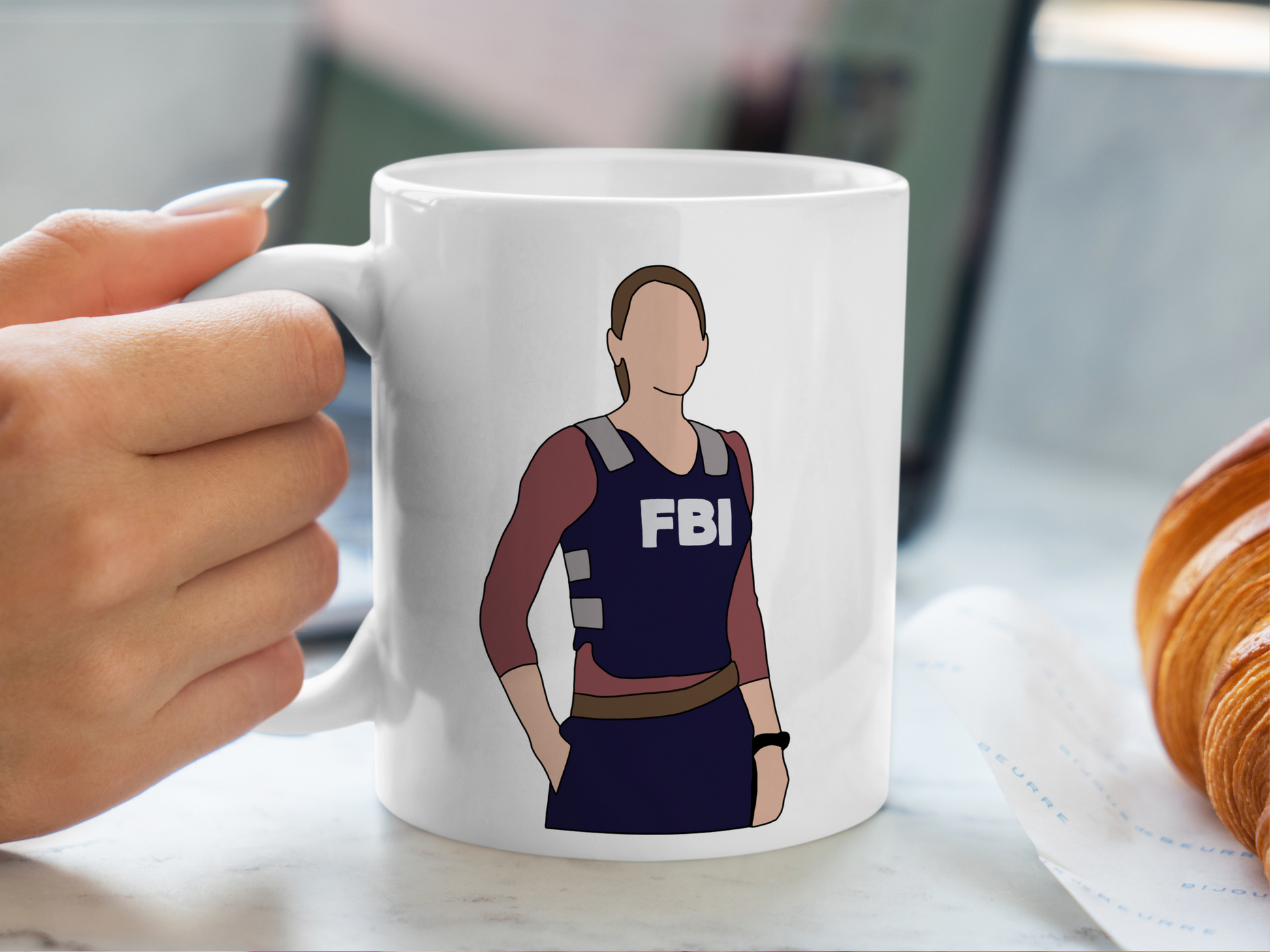 A white ceramic mug with a drawing of Emily Prentiss from Criminal Minds on the front. This is a 10oz mug which is perfect for fans of Criminal Minds, particularly the character Emily Prentiss. Made and sold by Krissi's Creations.