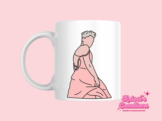 A white ceramic mug with a drawing of P!NK from her Summer Carnival 2024 on the front. This is a 10oz mug which is perfect for fans of Pink, particularly the Concert. Made and sold by Krissi's Creations.