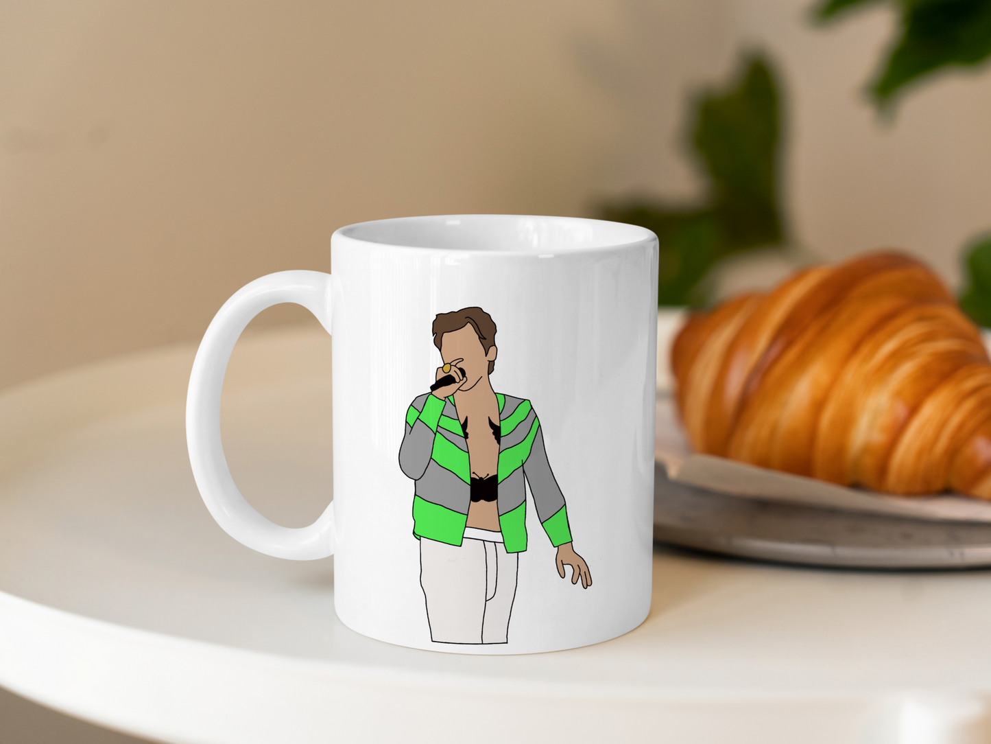 A white ceramic mug with a drawing of Harry Styles Slane Love On Tour Outfit on the front. This is a 10oz mug which is perfect for fans of Harry Styles Love on Tour Concert. Made and sold by Krissi's Creations.