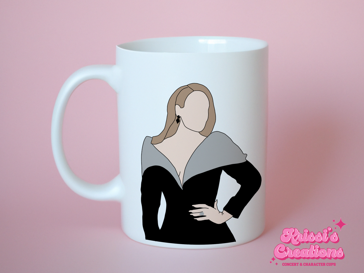 A white ceramic mug with a drawing of Adele on the front. This is a 10oz mug which is perfect for fans of Adele Vegas Residency Concerts. Made and sold by Krissi's Creations.