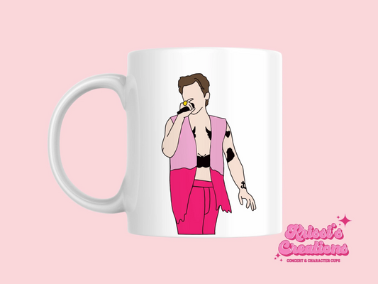 A white ceramic mug with a drawing of Harry Styles Edinburgh Night 2 Love On Tour Outfit on the front. This is a 10oz mug which is perfect for fans of Harry Styles Love on Tour Concert. Made and sold by Krissi's Creations.