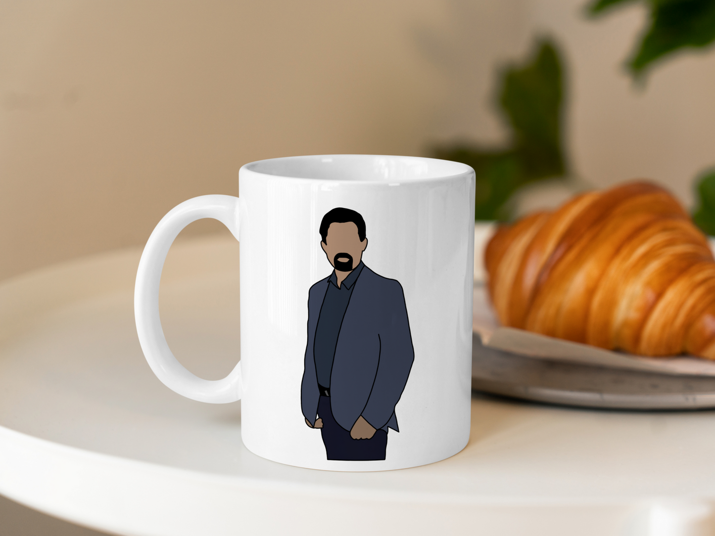 A white ceramic mug with a drawing of David Rossi from Criminal Minds on the front. This is a 10oz mug which is perfect for fans of Criminal Minds, particularly the character David Rossi. Made and sold by Krissi's Creations.