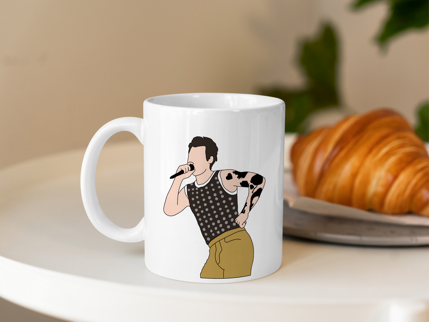 A white ceramic mug with a drawing of Harry Styles Cardiff Night 1 Outfit on the front. This is a 10oz mug which is perfect for fans of Harry Styles Love on Tour Concert. Made and sold by Krissi's Creations.