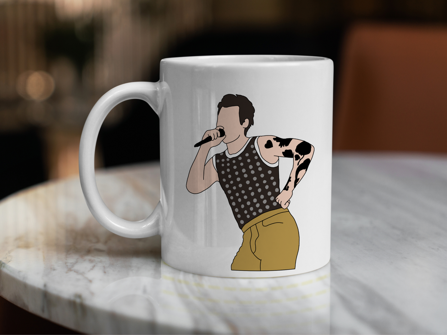 A white ceramic mug with a drawing of Harry Styles Cardiff Night 1 Outfit on the front. This is a 10oz mug which is perfect for fans of Harry Styles Love on Tour Concert. Made and sold by Krissi's Creations.