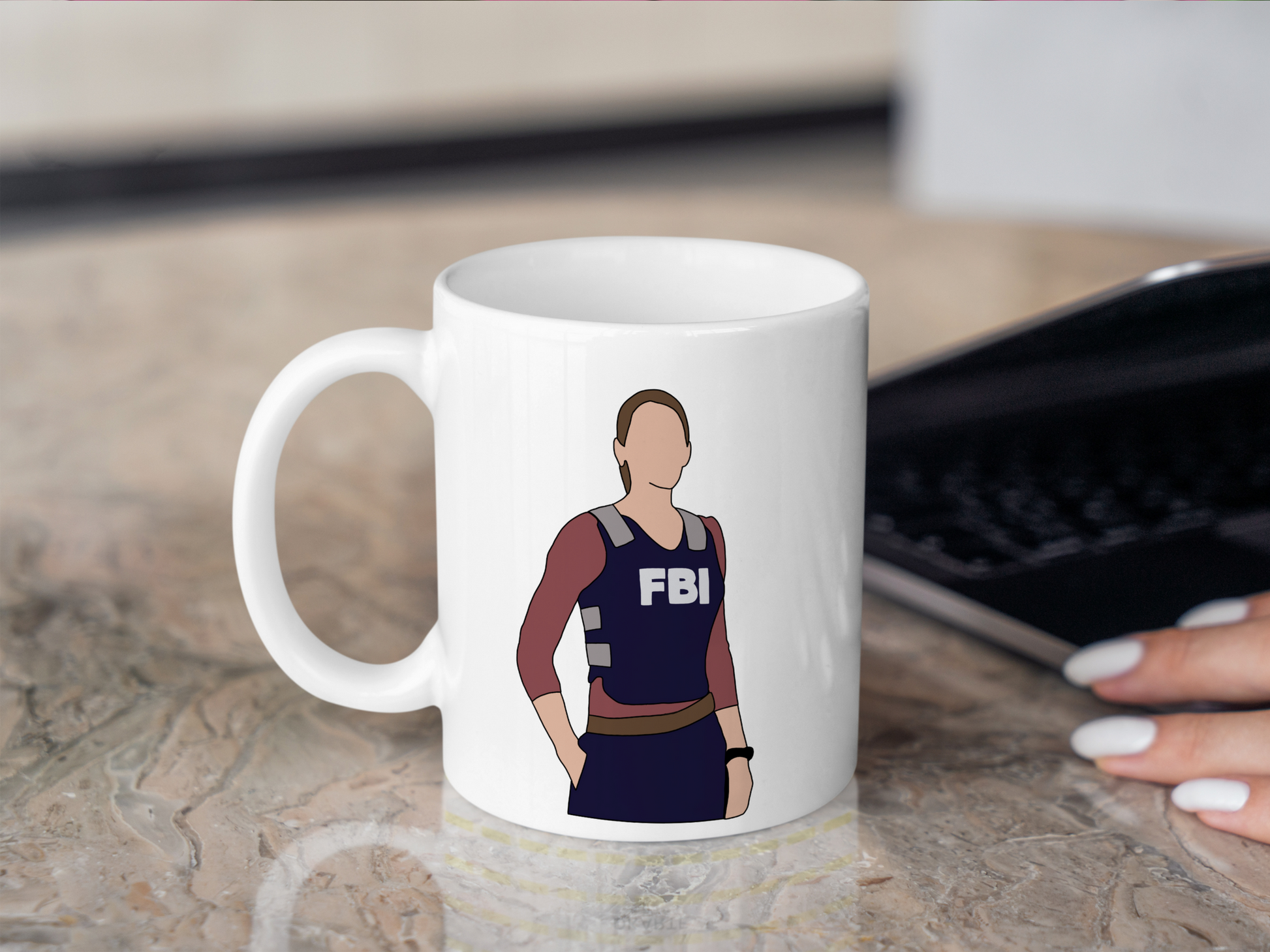 A white ceramic mug with a drawing of Emily Prentiss from Criminal Minds on the front. This is a 10oz mug which is perfect for fans of Criminal Minds, particularly the character Emily Prentiss. Made and sold by Krissi's Creations.