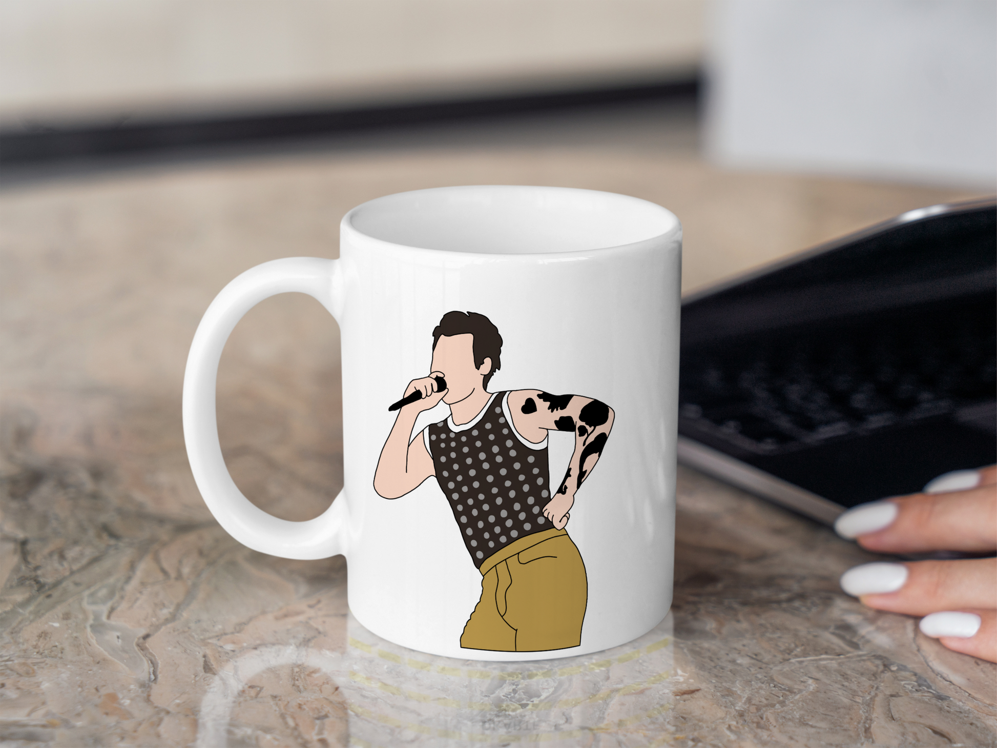 A white ceramic mug with a drawing of Harry Styles Cardiff Night 1 Outfit on the front. This is a 10oz mug which is perfect for fans of Harry Styles Love on Tour Concert. Made and sold by Krissi's Creations.