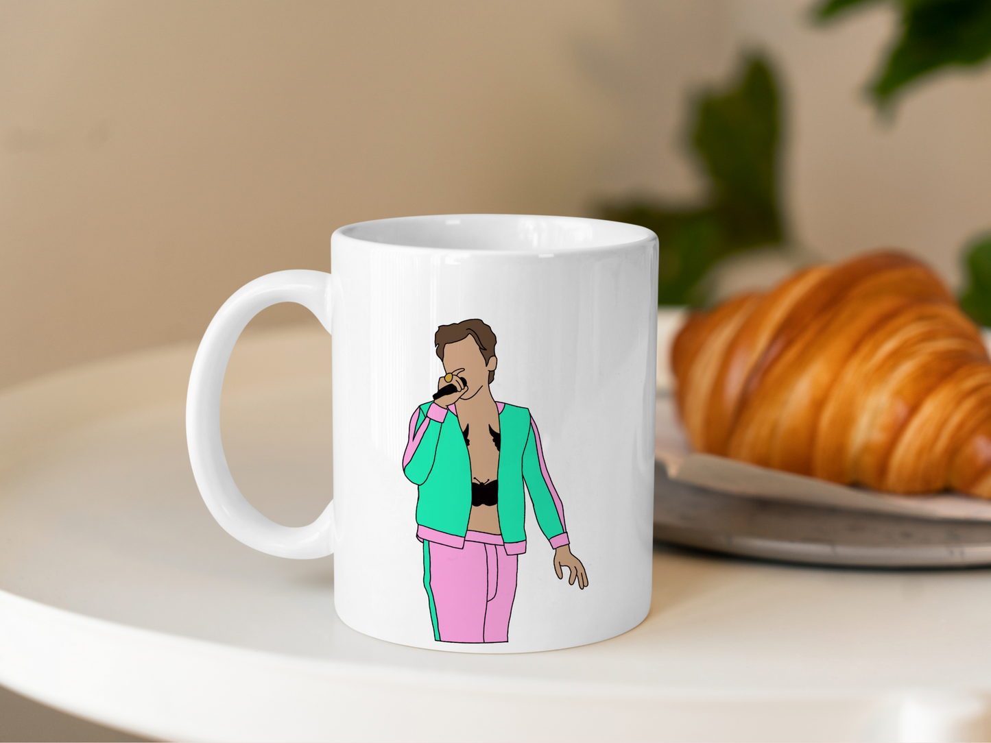 A white ceramic mug with a drawing of Harry Styles Coventry Night 2 Love On Tour Outfit on the front. This is a 10oz mug which is perfect for fans of Harry Styles Love on Tour Concert. Made and sold by Krissi's Creations.