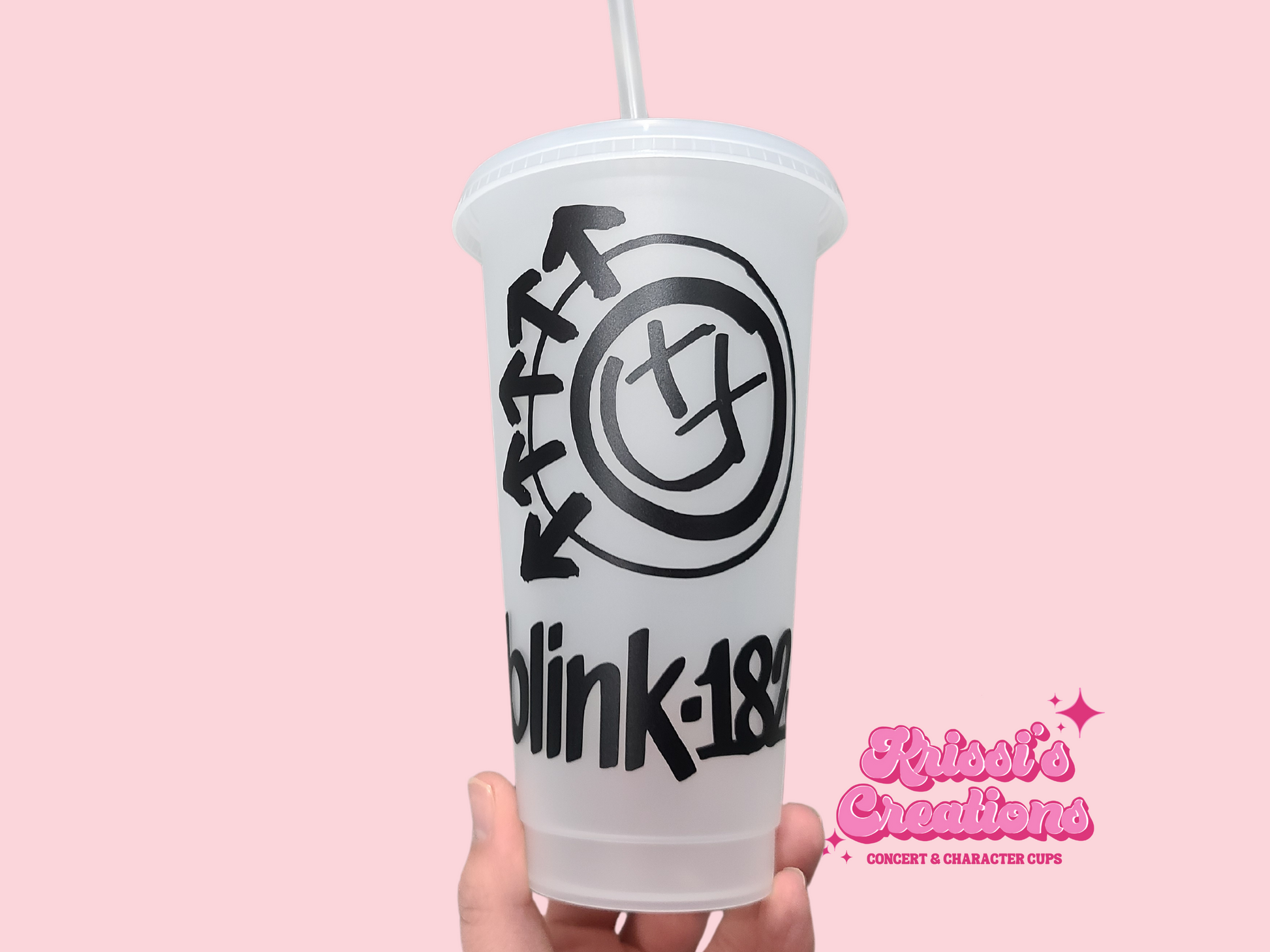 A frosted plastic cup featuring the iconic Blink 182 logo on the front, with a lid and straw included.