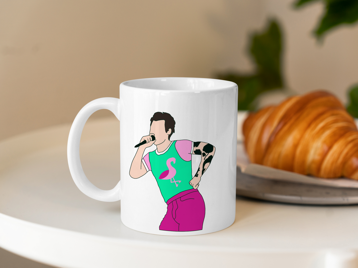 A white ceramic mug with a drawing of Harry Styles Cardiff Night 2 Outfit on the front. This is a 10oz mug which is perfect for fans of Harry Styles Love on Tour Concert. Made and sold by Krissi's Creations.